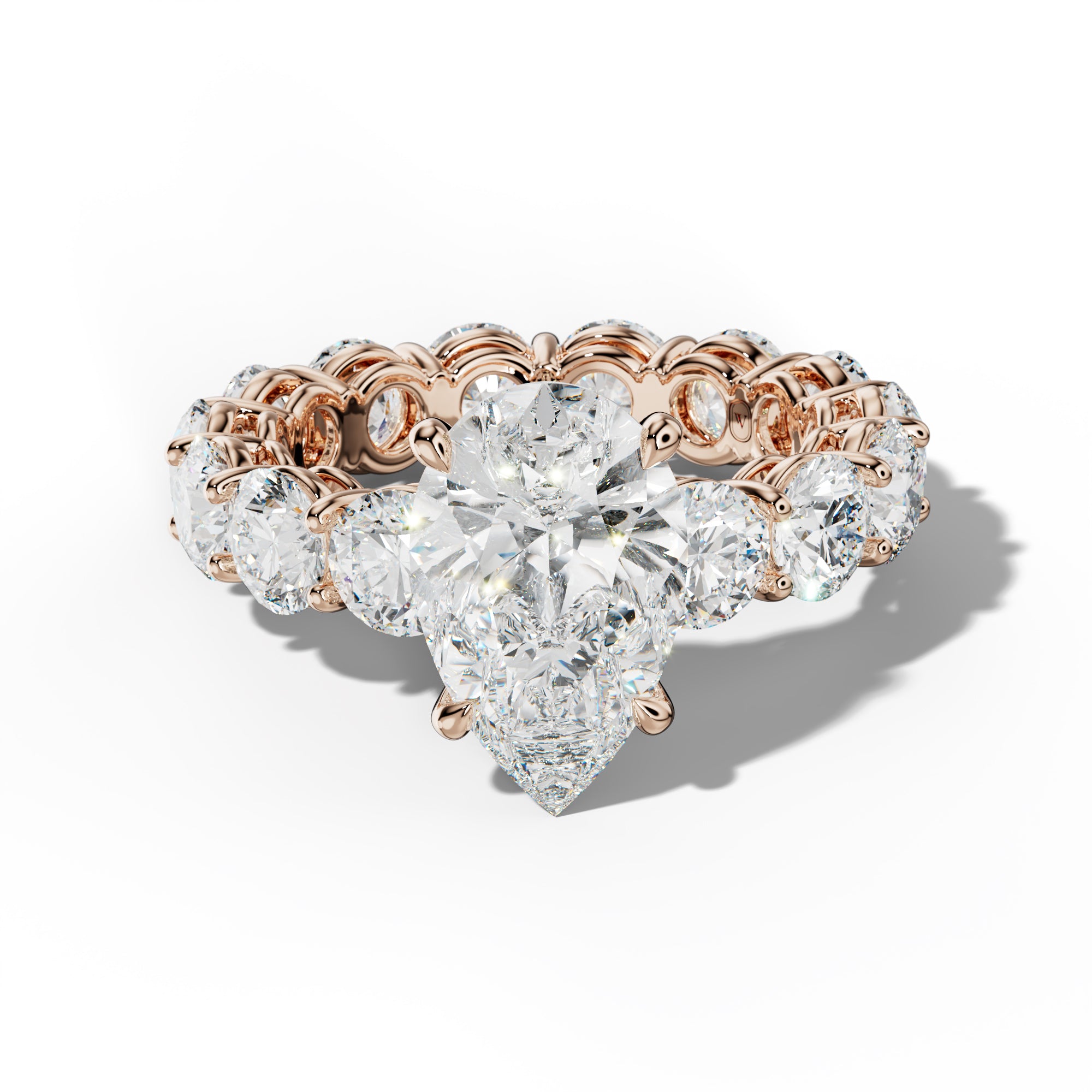 Maddie Pear Shape Engagement Ring With Round Side Stones