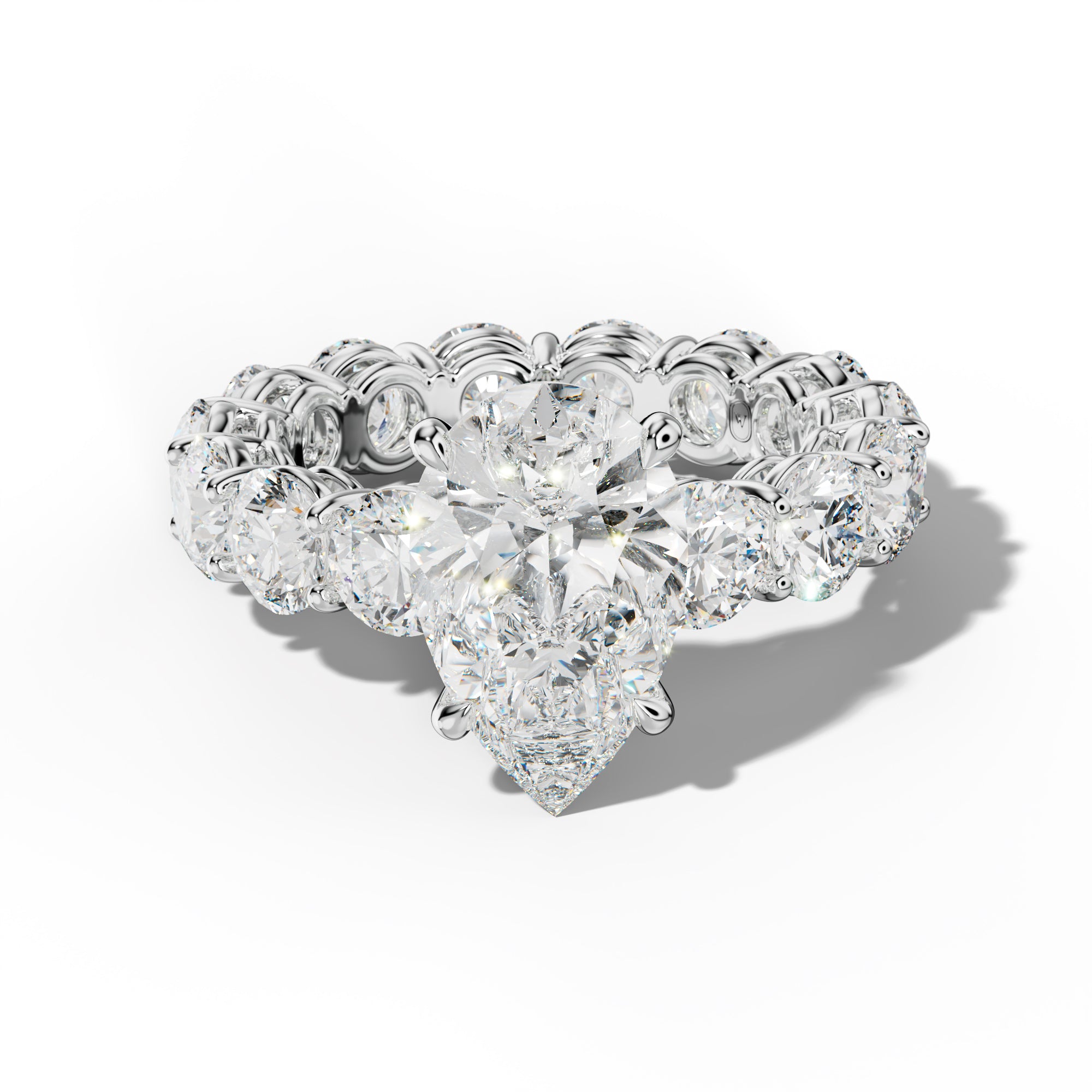 Maddie Pear Shape Engagement Ring With Round Side Stones