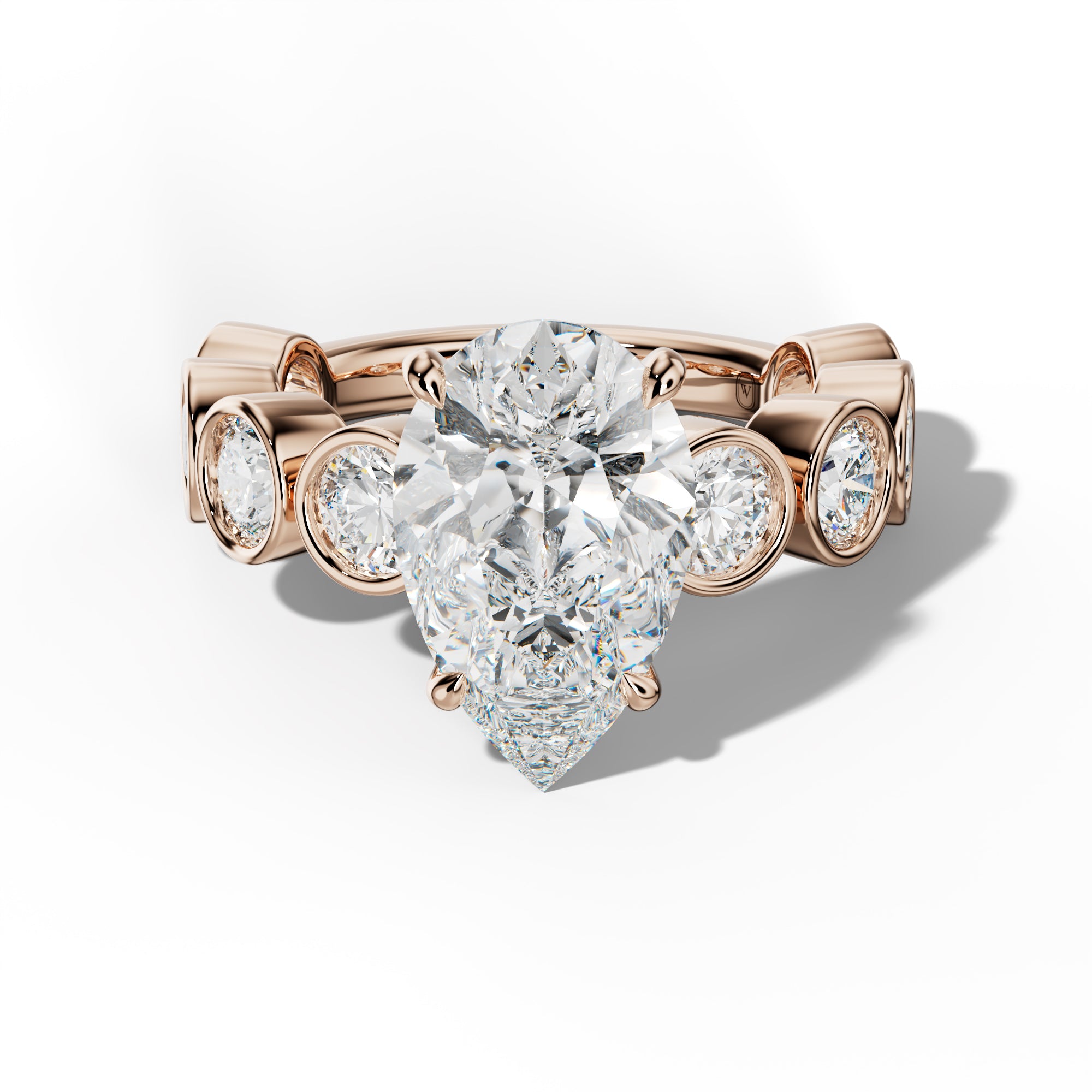Raegan Pear Shape Engagement Ring With Round Side Stones