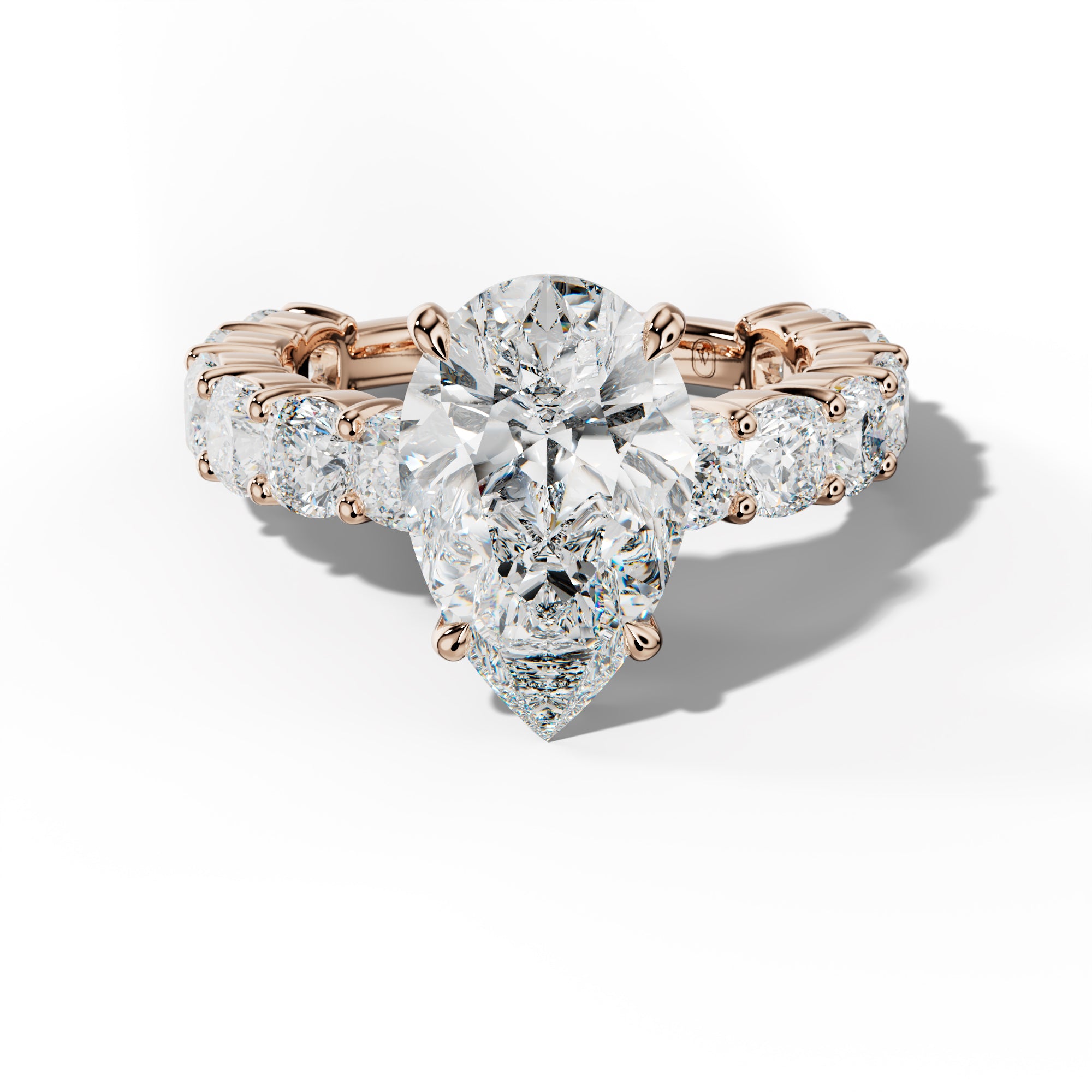 Scottie Pear Shape Engagement Ring With Cushion Side Stones