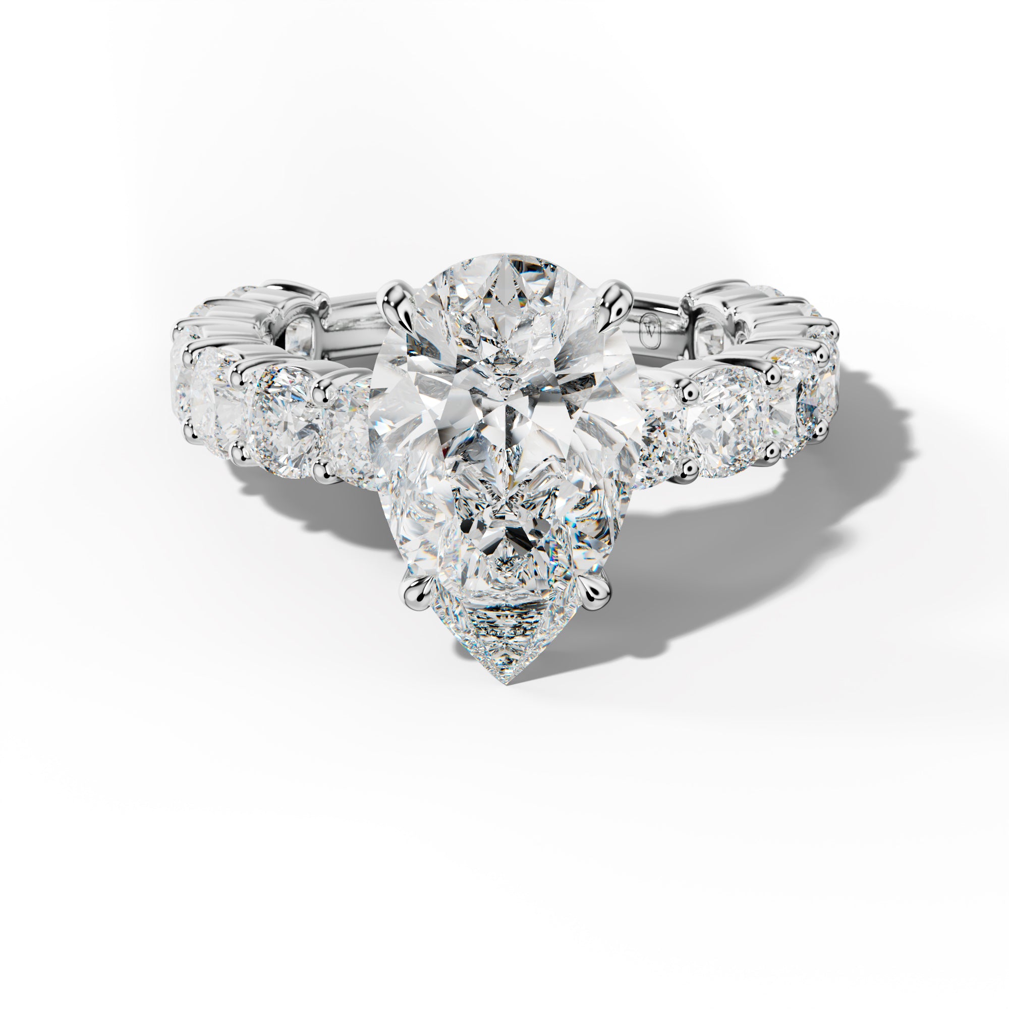 Scottie Pear Shape Engagement Ring With Cushion Side Stones