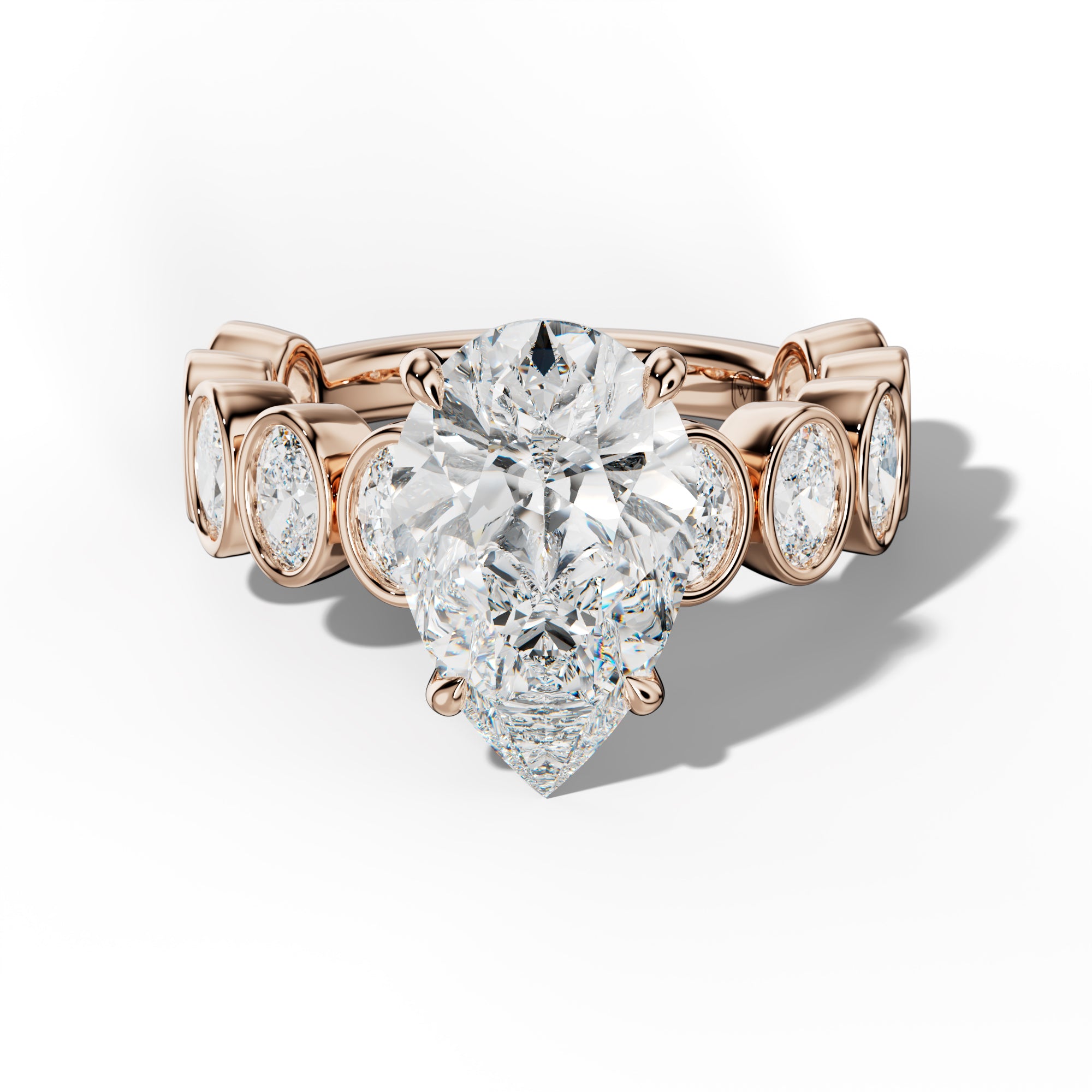 Linda Pear Shape Engagement Ring With Oval Side Stones