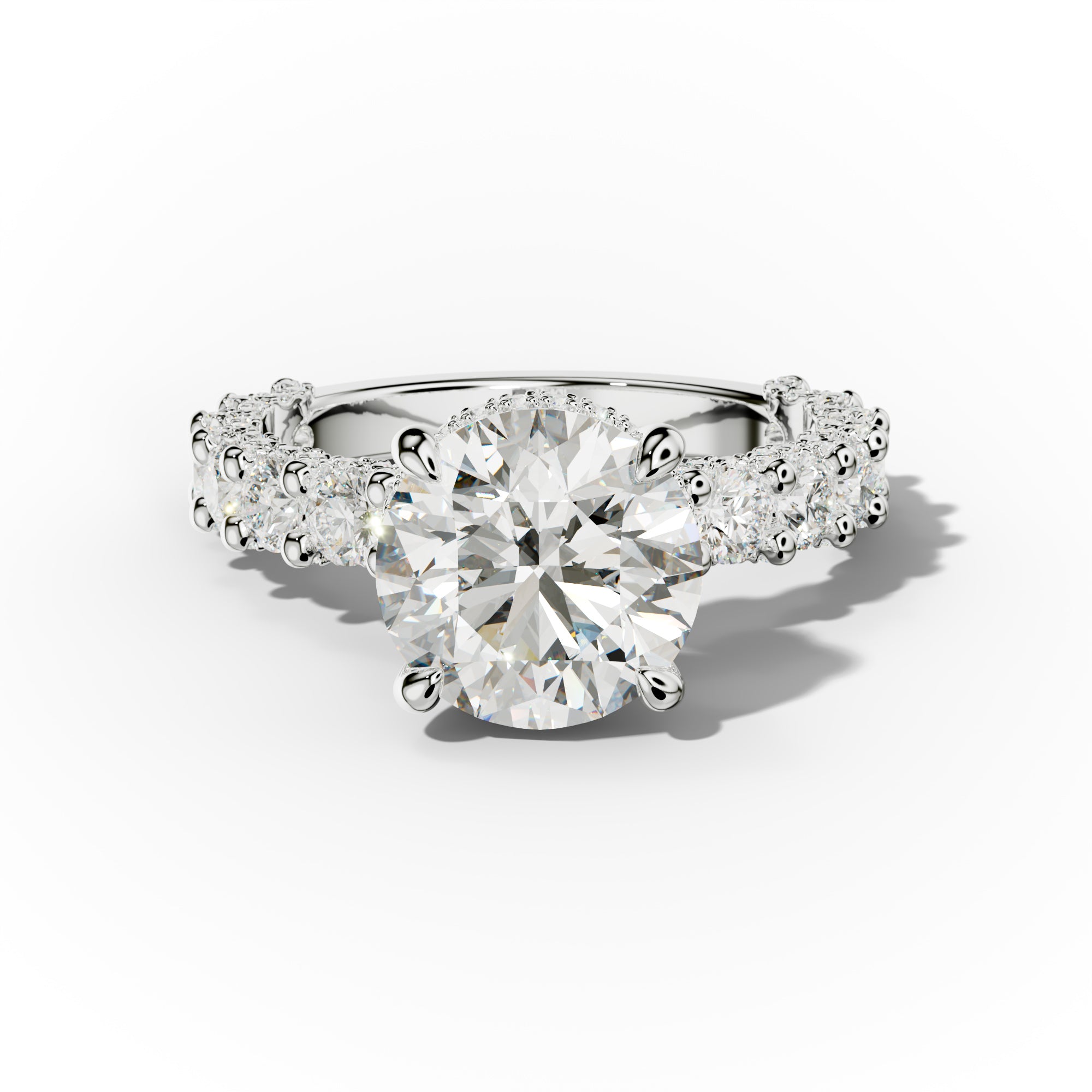 A round diamond engagement ring with a hidden halo design and accent diamonds on the band.
