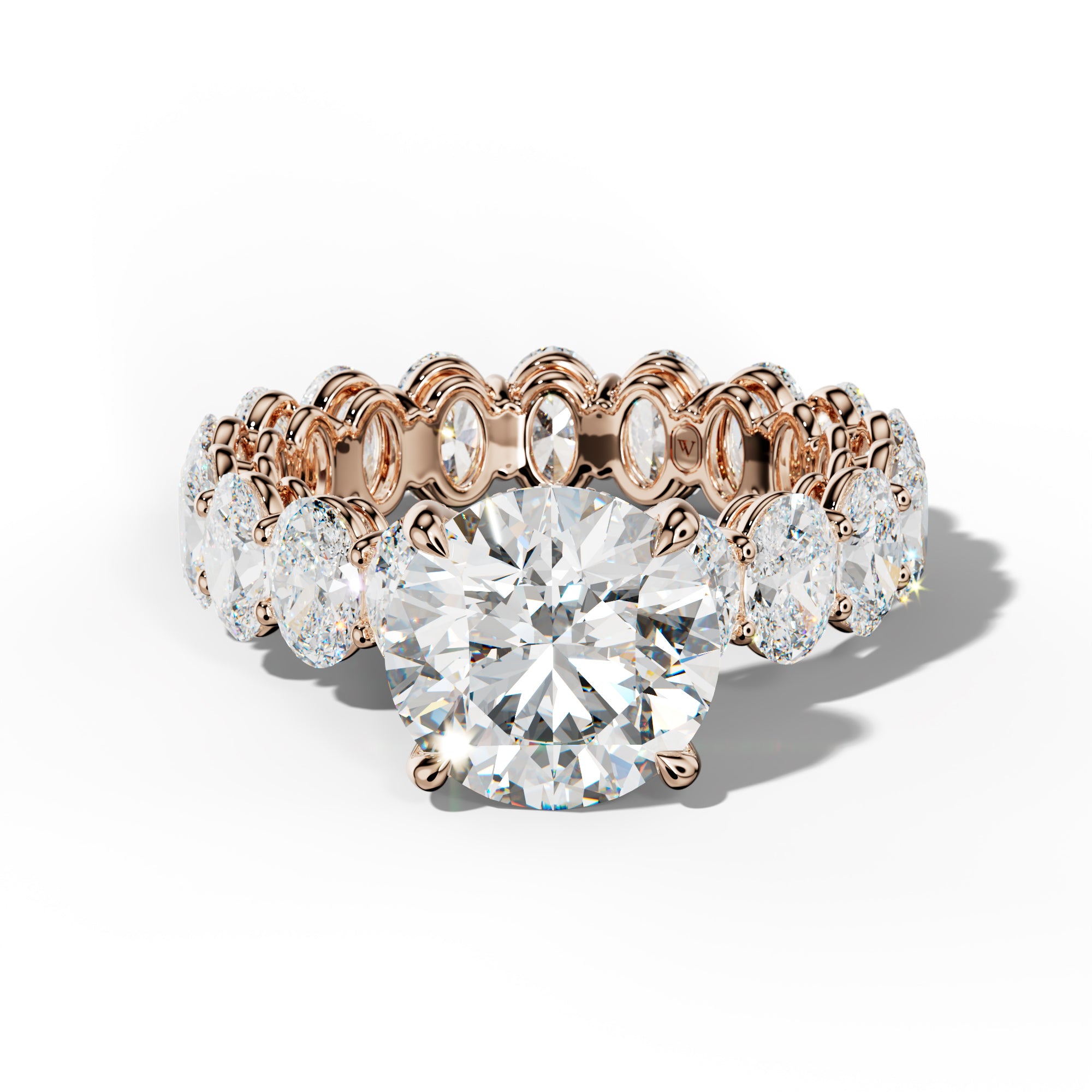 Amoura Round Diamond Engagement Ring With Oval Side Stones