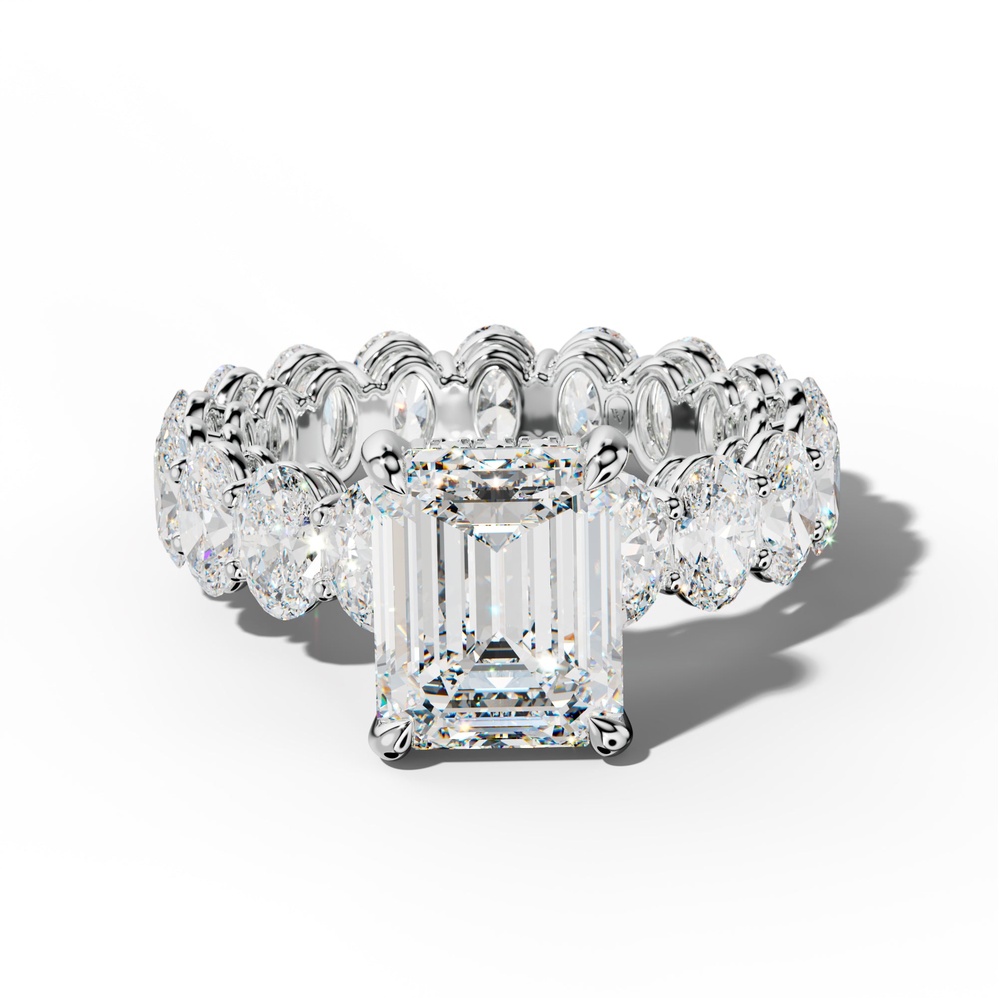 Amoura Emerald Cut Engagement Ring With Oval Side Stones