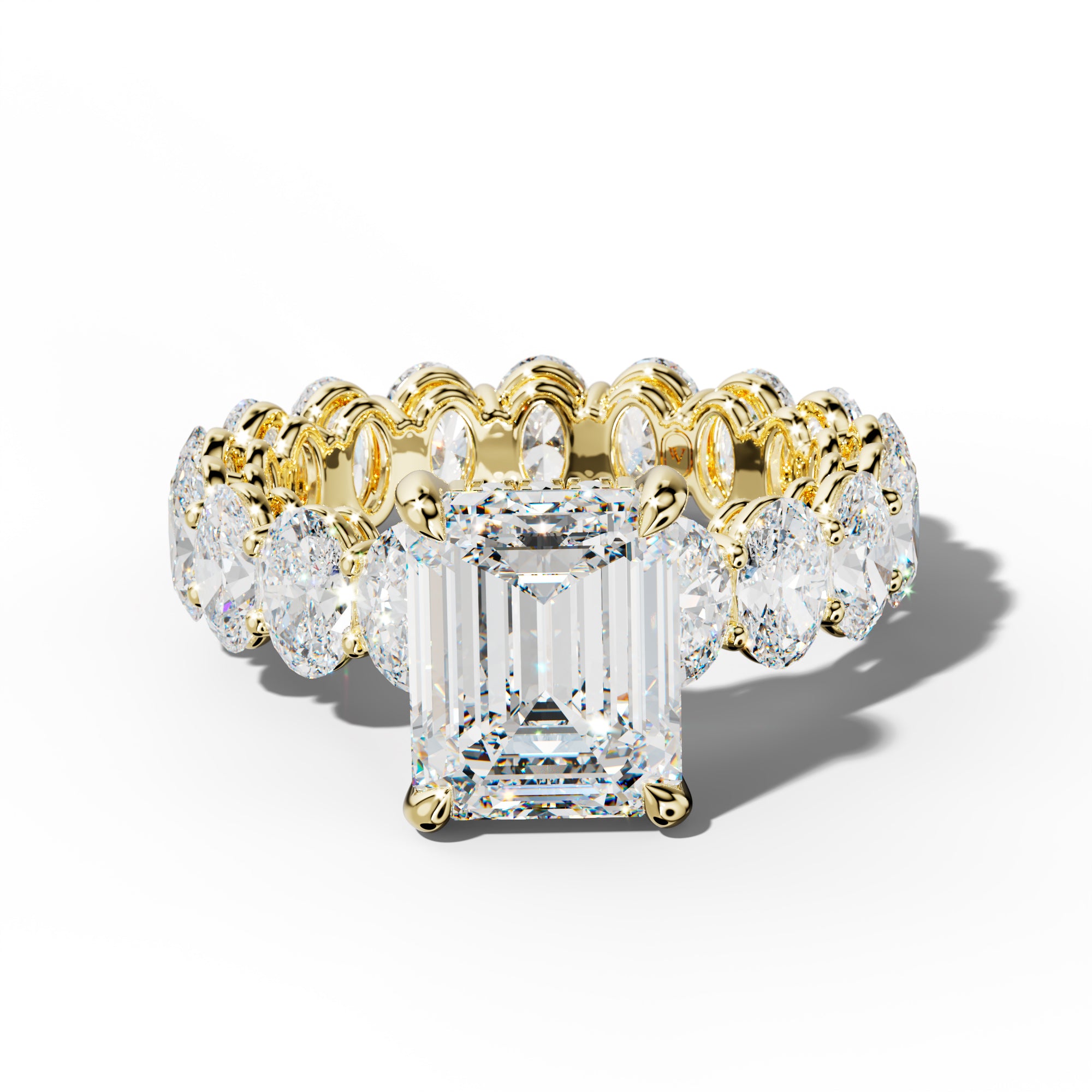 Amoura Emerald Cut Engagement Ring With Oval Side Stones