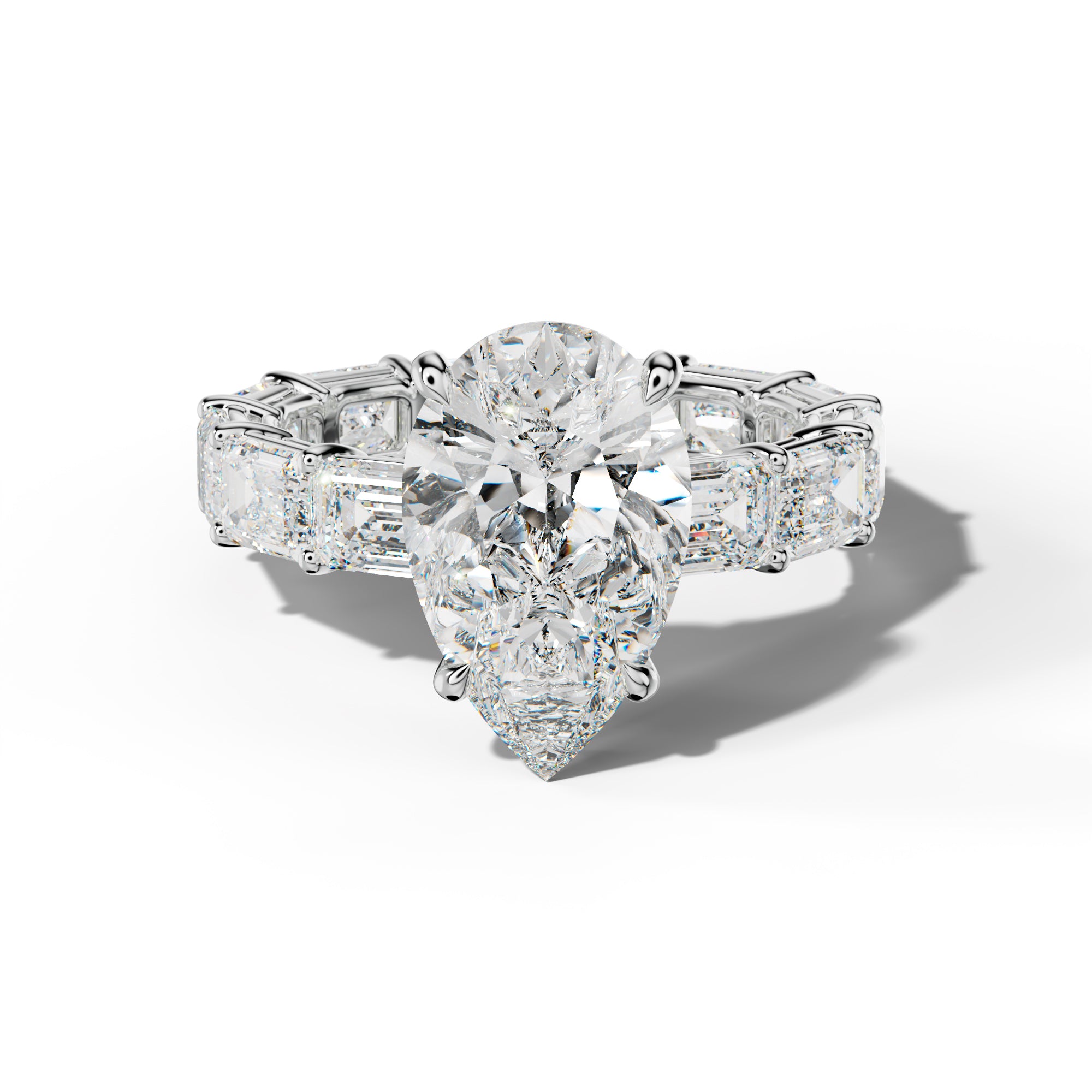 Miracle Pear Shape Engagement Ring With East West Emerald Cut Side Stones
