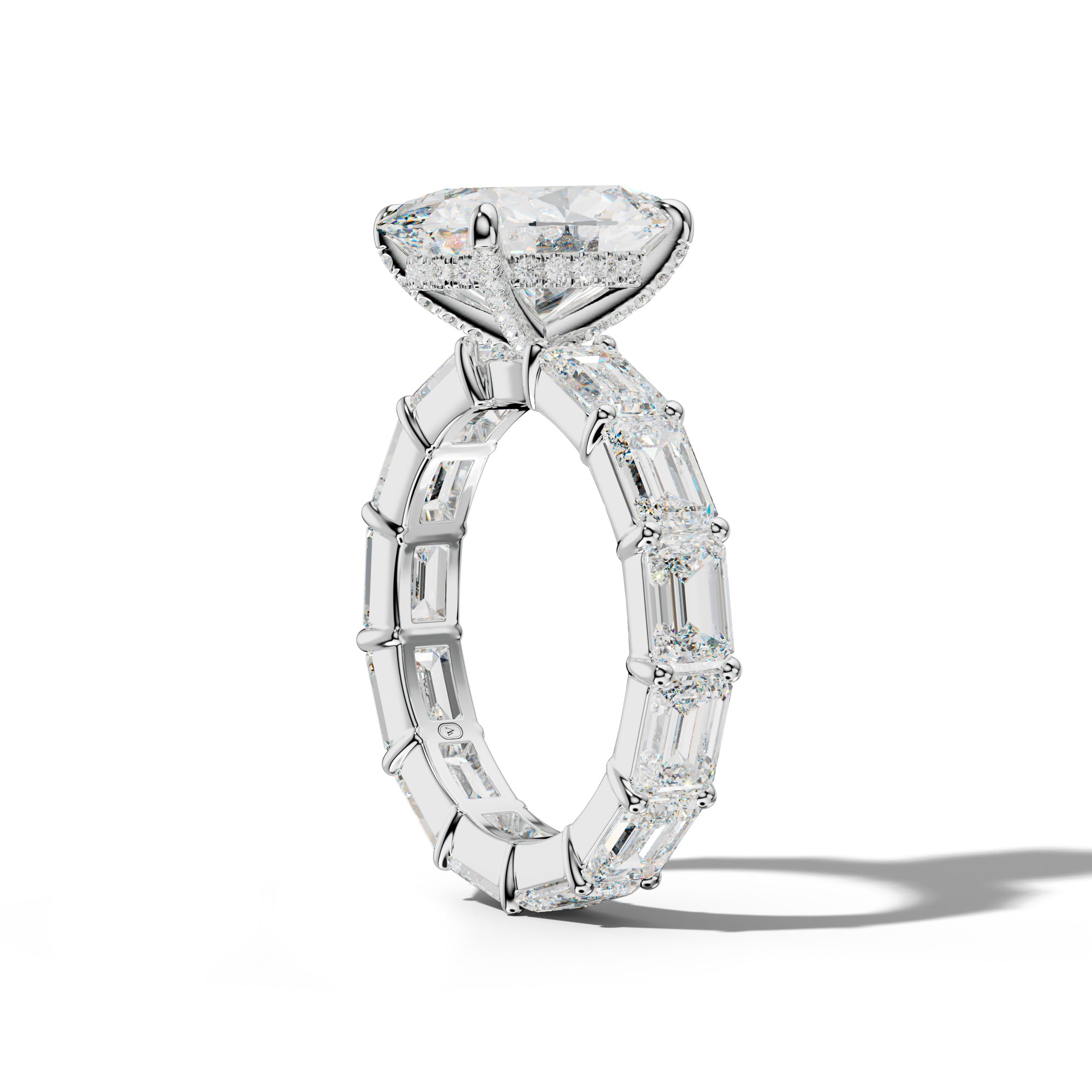 Romina Oval Diamond Engagement Ring With East West Emerald Cut Side Stones