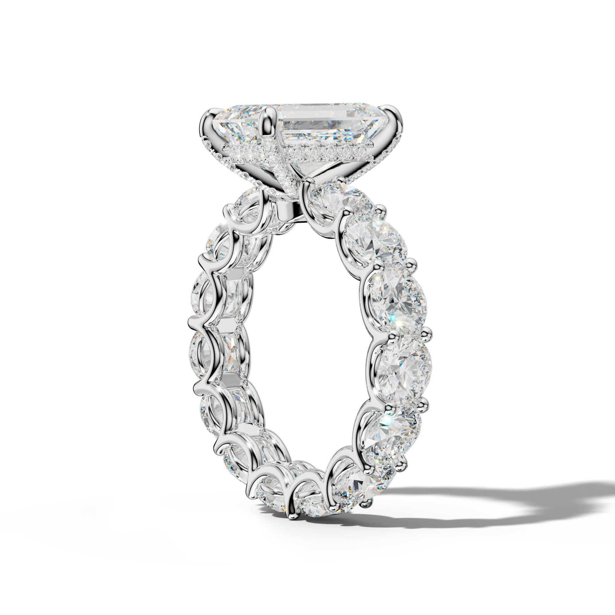 Daisy Emerald Cut Engagement Ring With Round Side Stones