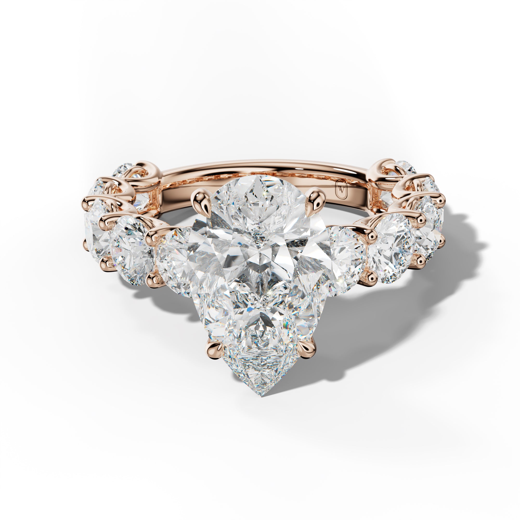 Josie Pear Shape Engagement Ring With Round Side Stones