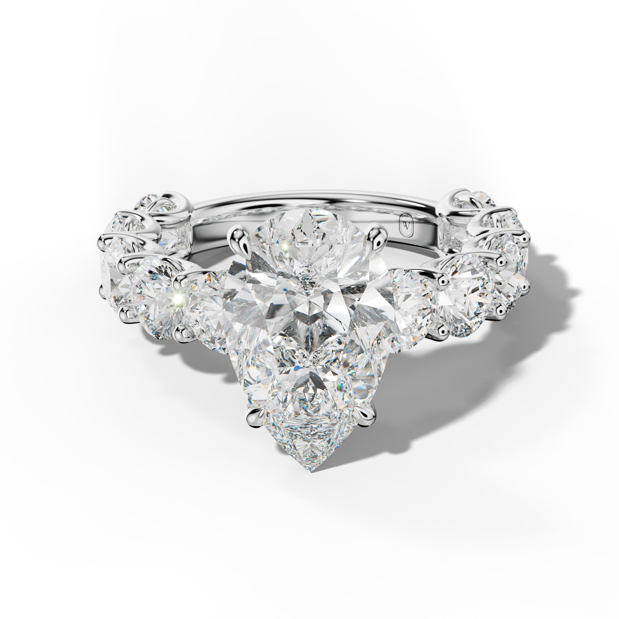 Josie Pear Shape Engagement Ring With Round Side Stones