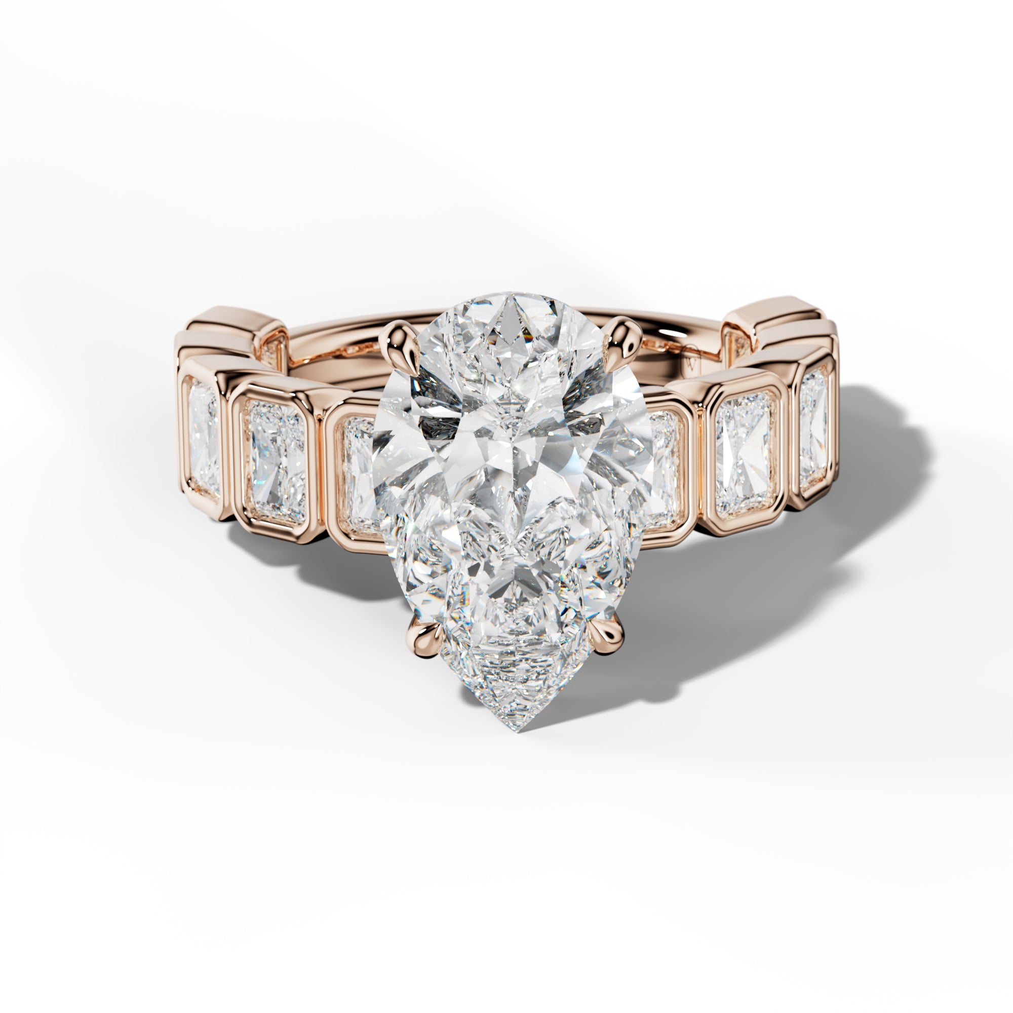 Jaslyn Pear Shape Engagement Ring With Radiant Side Stones