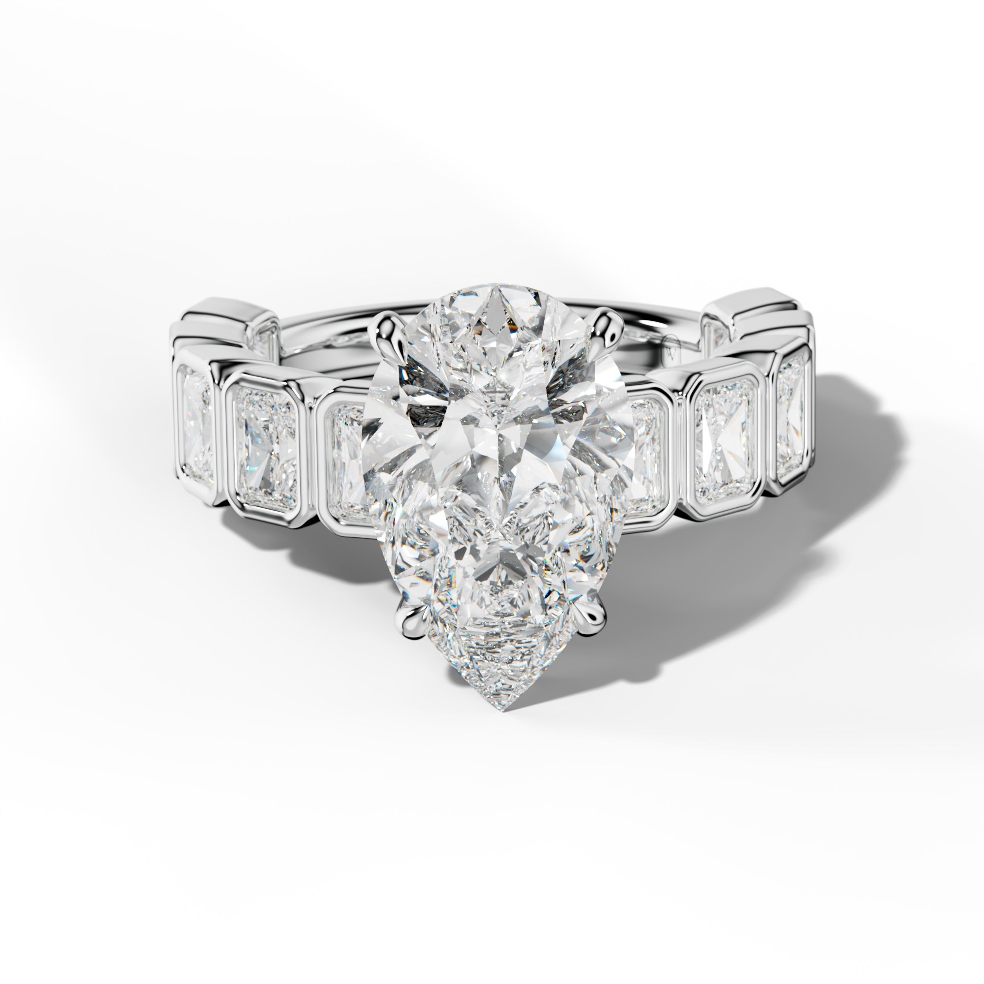 Jaslyn Pear Shape Engagement Ring With Radiant Side Stones