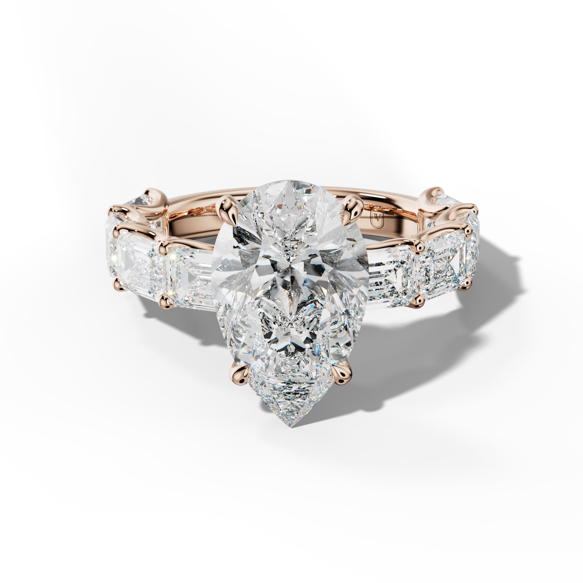 Oaklynn Pear Shape Engagement Ring With East West Emerald Side Stones