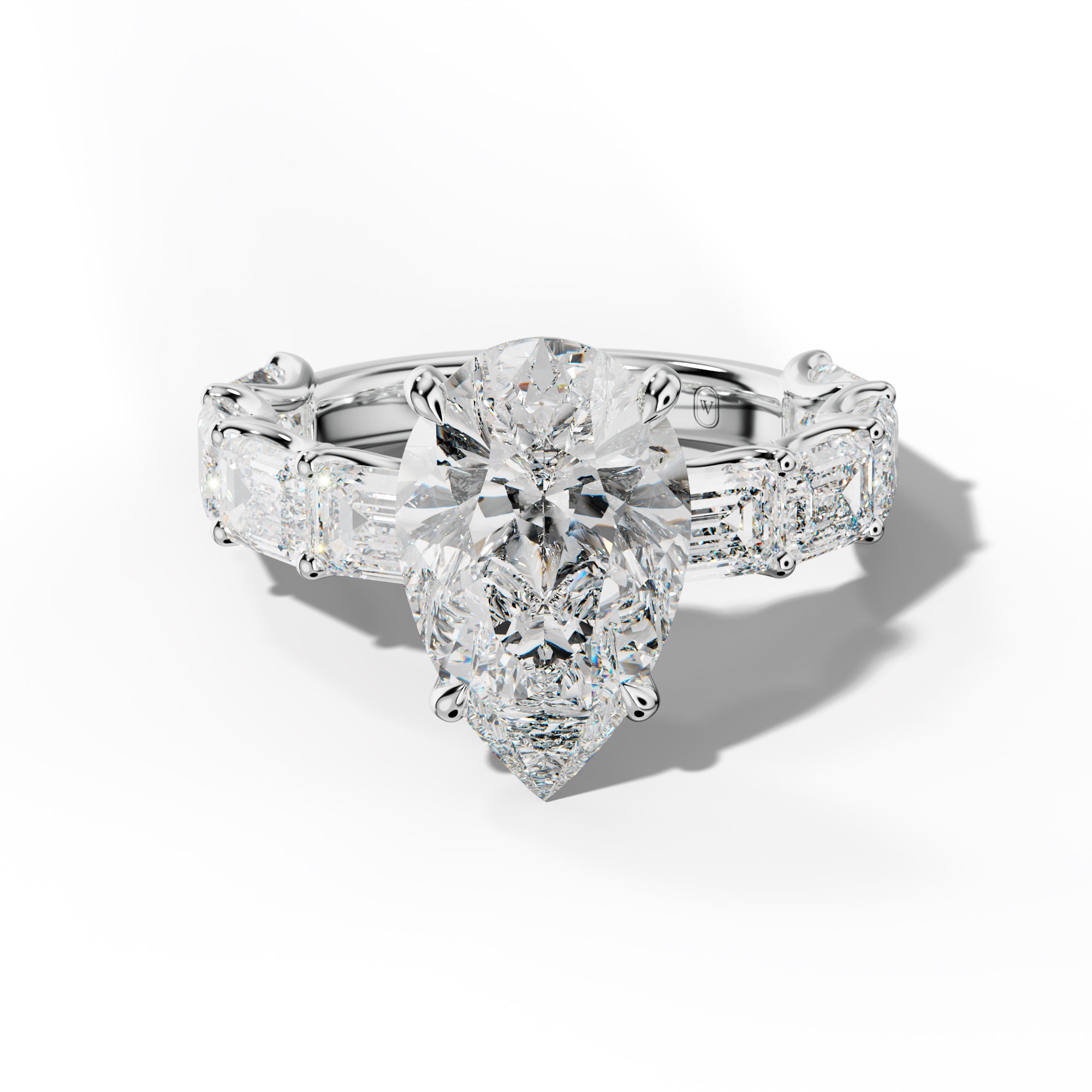 Oaklynn Pear Shape Engagement Ring With East West Emerald Side Stones