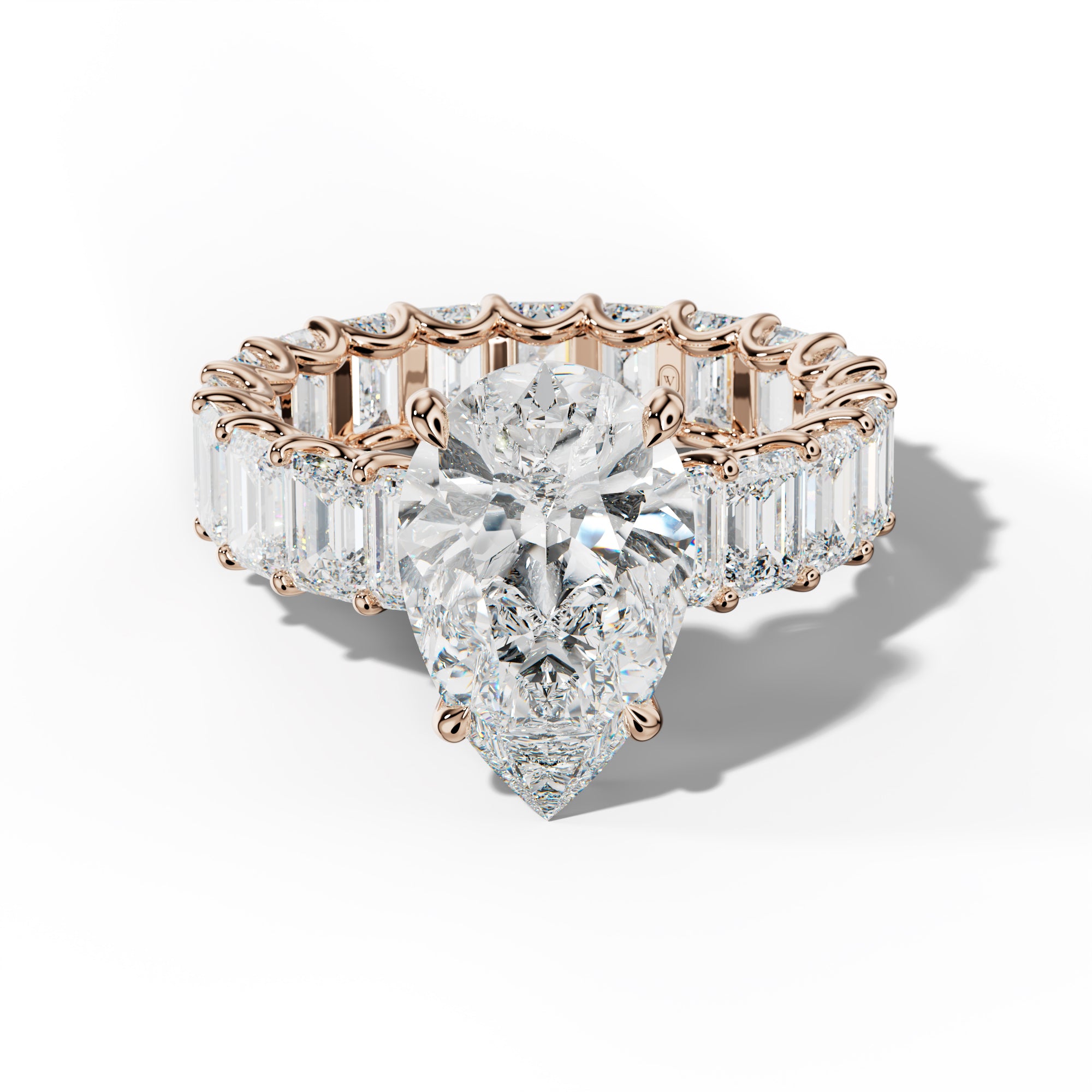 Seraphina Pear Shape Engagement Ring With Emerald Side Stones