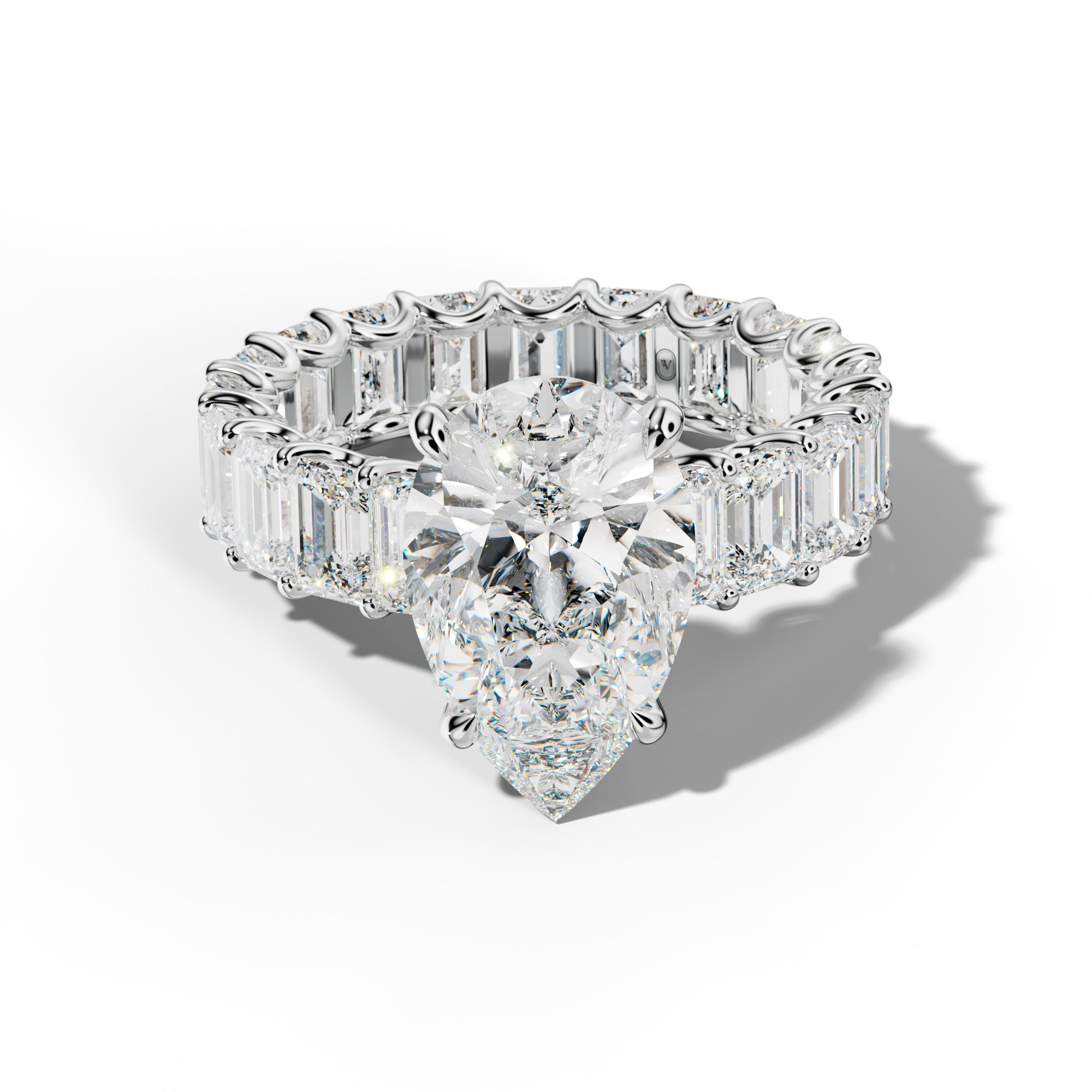 Seraphina Pear Shape Engagement Ring With Emerald Side Stones