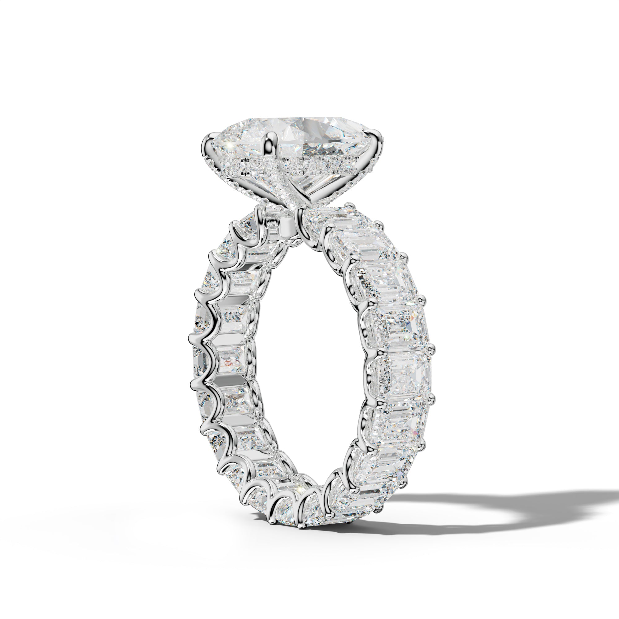 Seraphina Pear Shape Engagement Ring With Emerald Side Stones