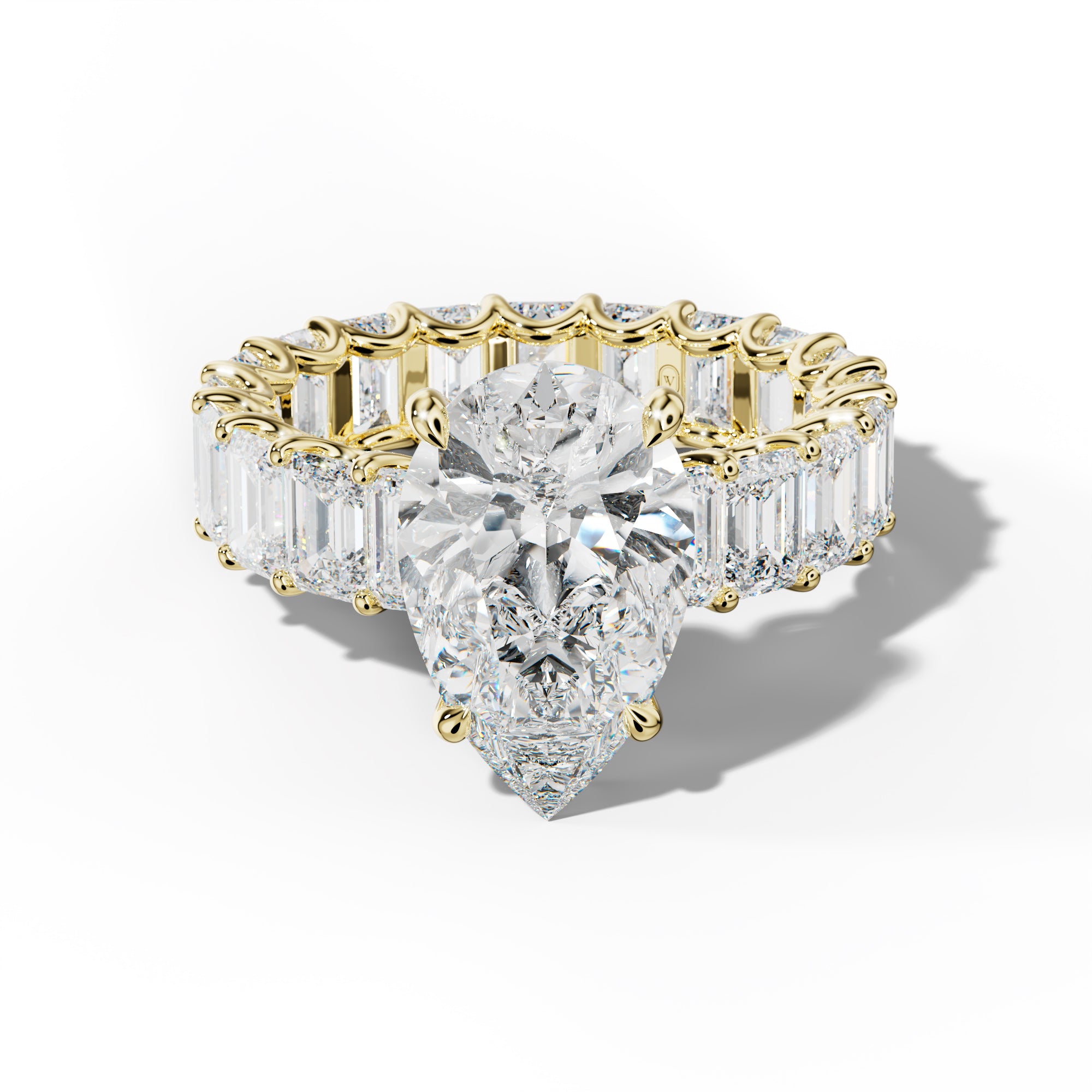 Seraphina Pear Shape Engagement Ring With Emerald Side Stones