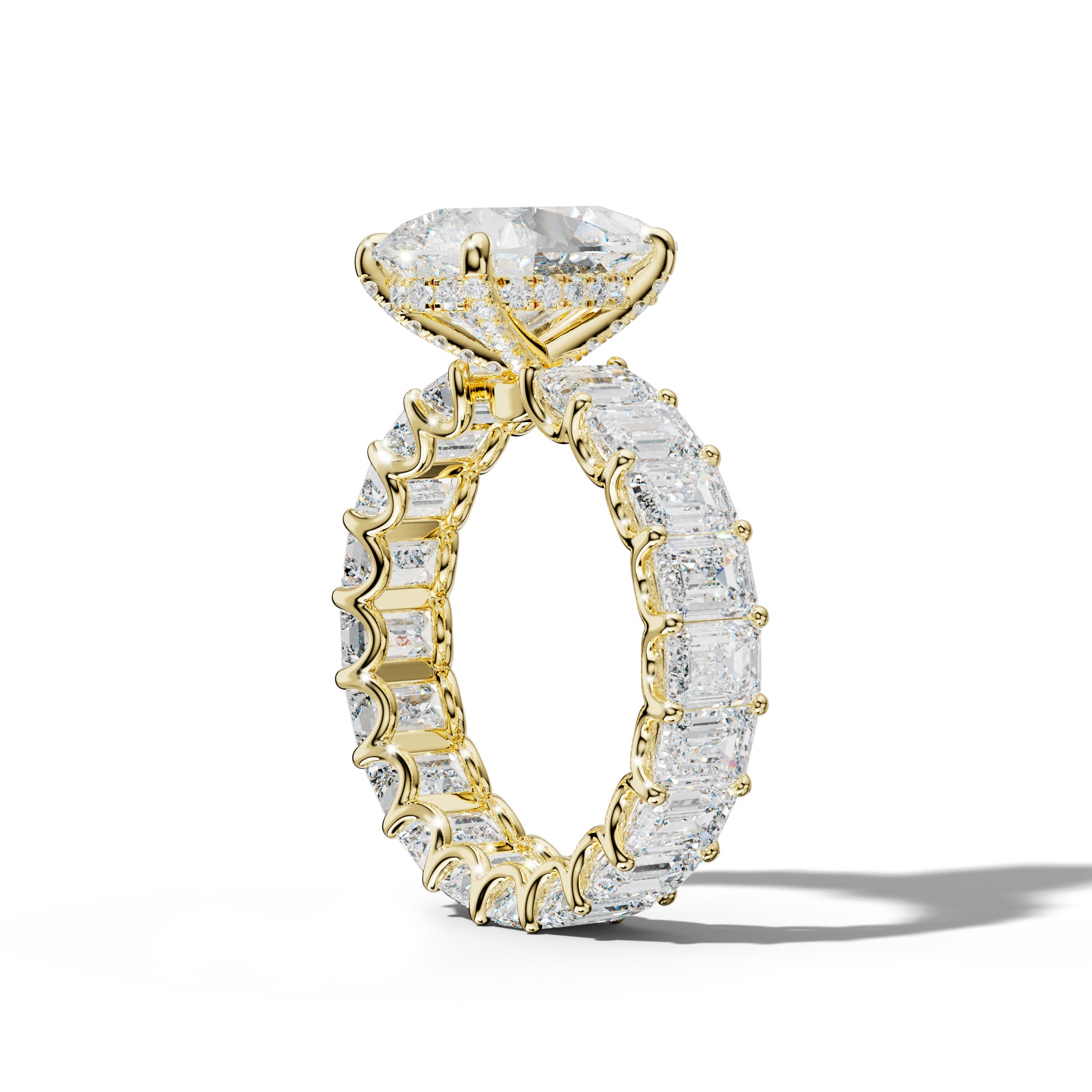 Seraphina Pear Shape Engagement Ring With Emerald Side Stones