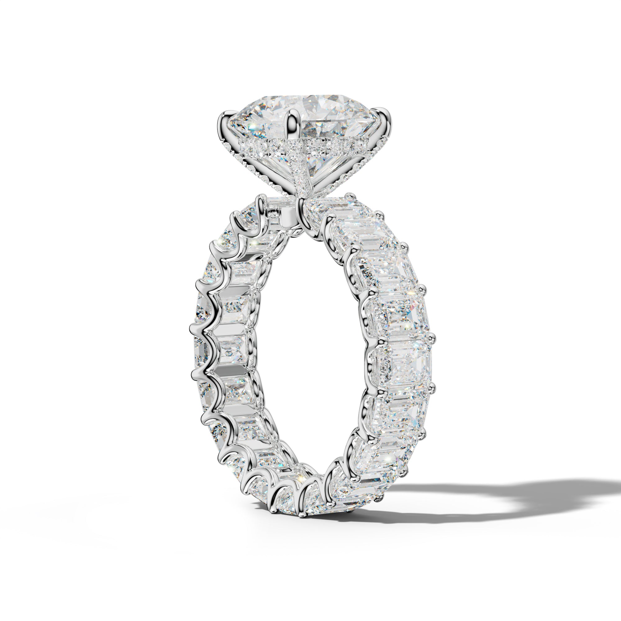Seraphina Round Diamond Engagement Ring With Emerald Side Stones