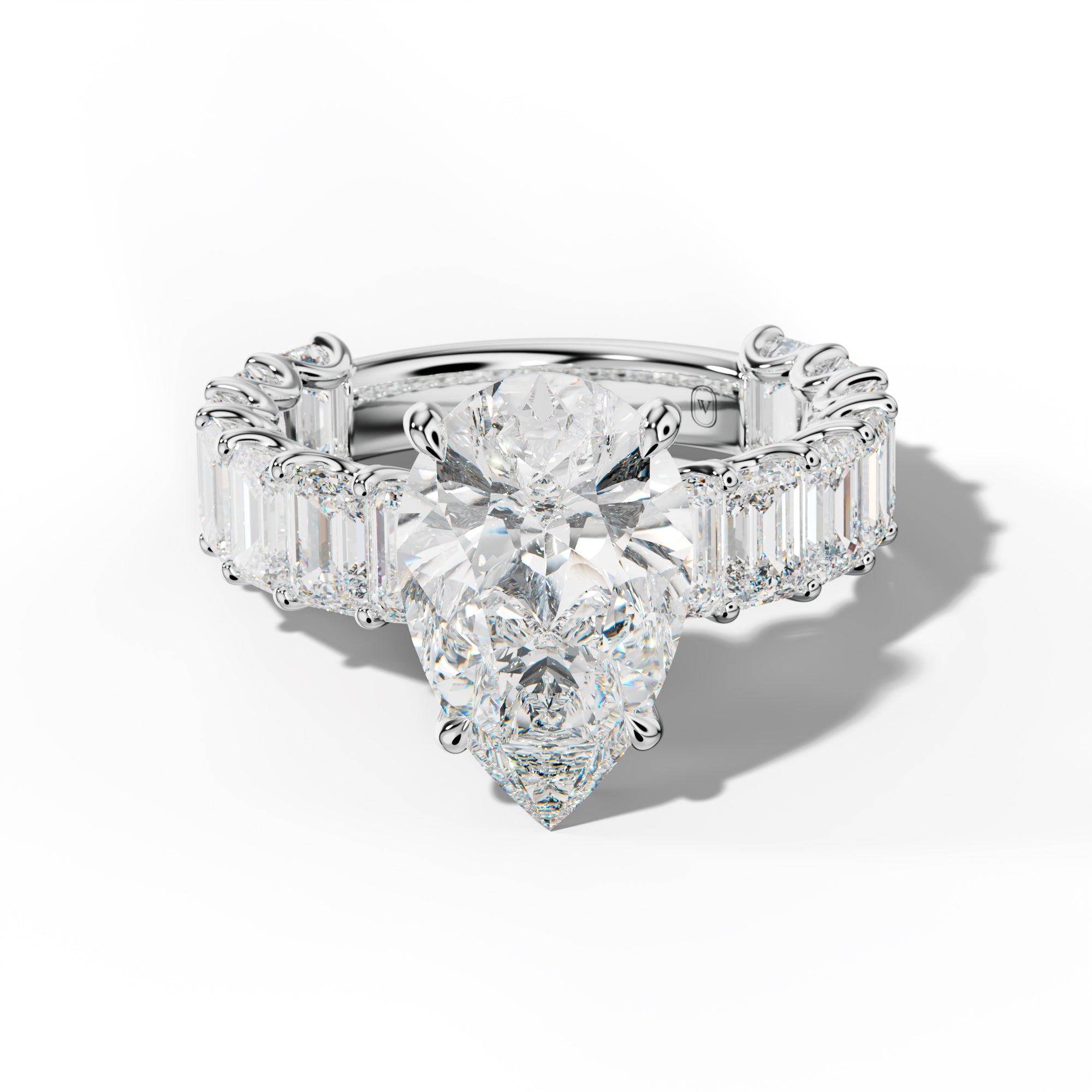 Vivienne Pear Shape Engagement Ring With Emerald Side Stones