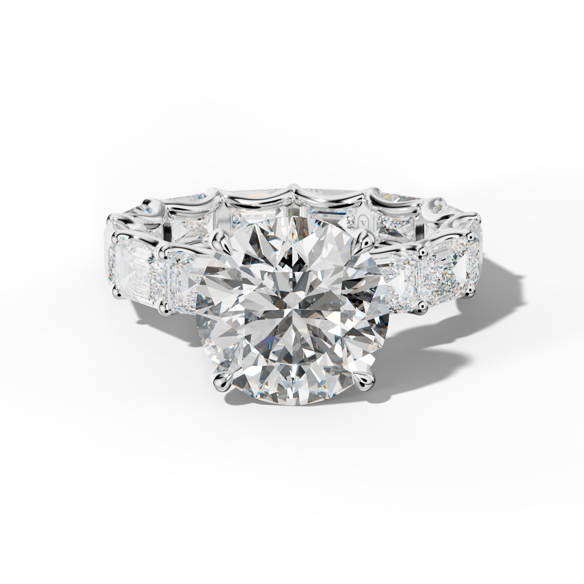 Tiffany Round Diamond Engagement Ring With East West Emerald Side Stones