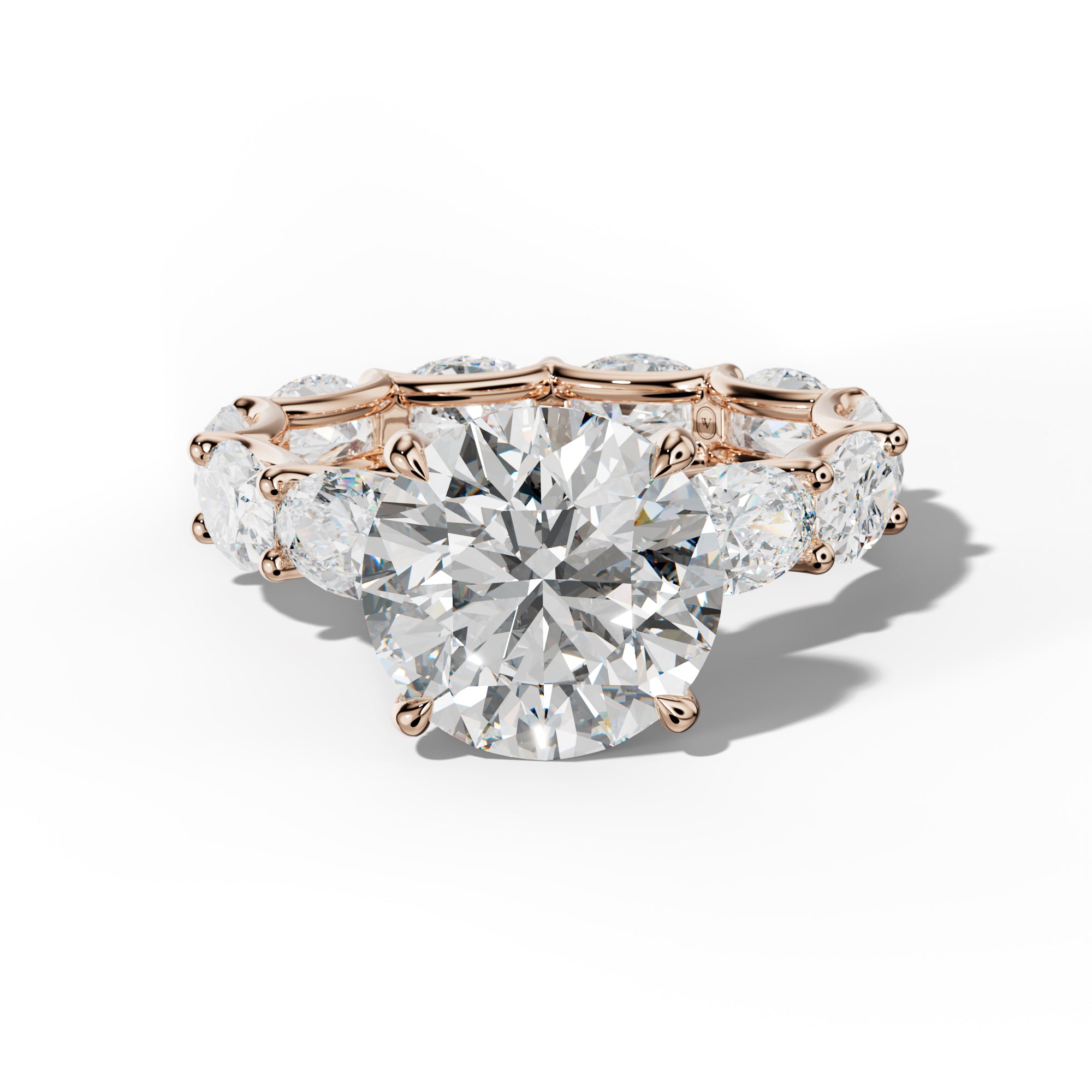 Paisley Round Diamond Engagement Ring With East West Oval Side Stones
