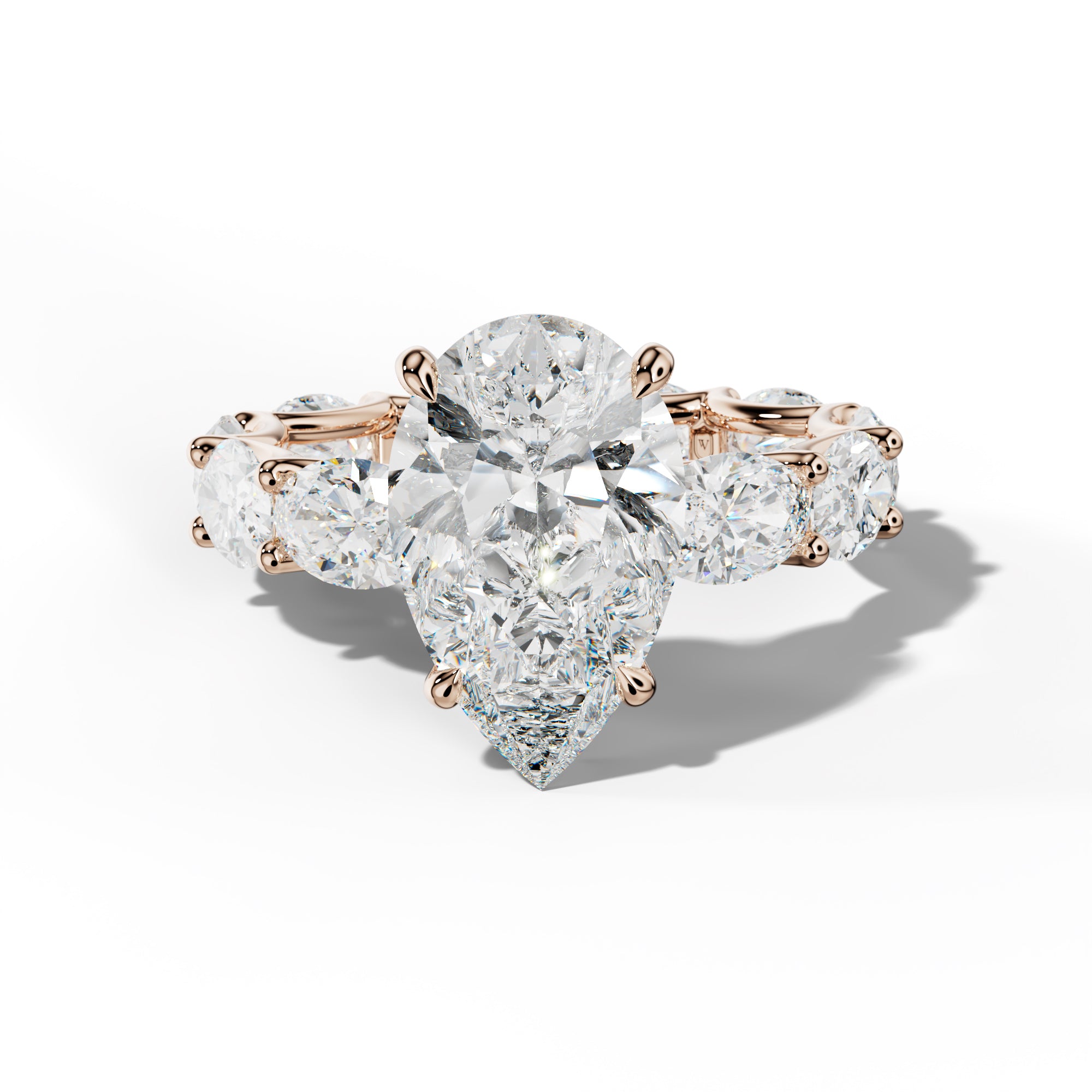 Paisley Pear Shape Diamond Engagement Ring With East West Oval Side Stones