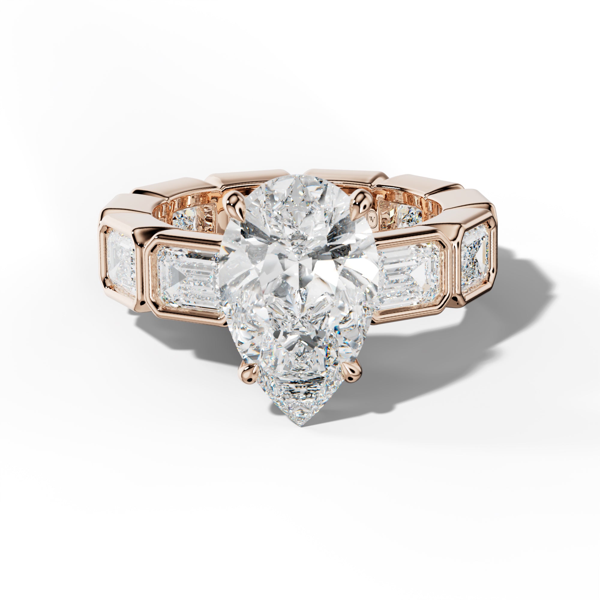 Violeta Pear Shape Engagement Ring With East West Emerald Side Stones