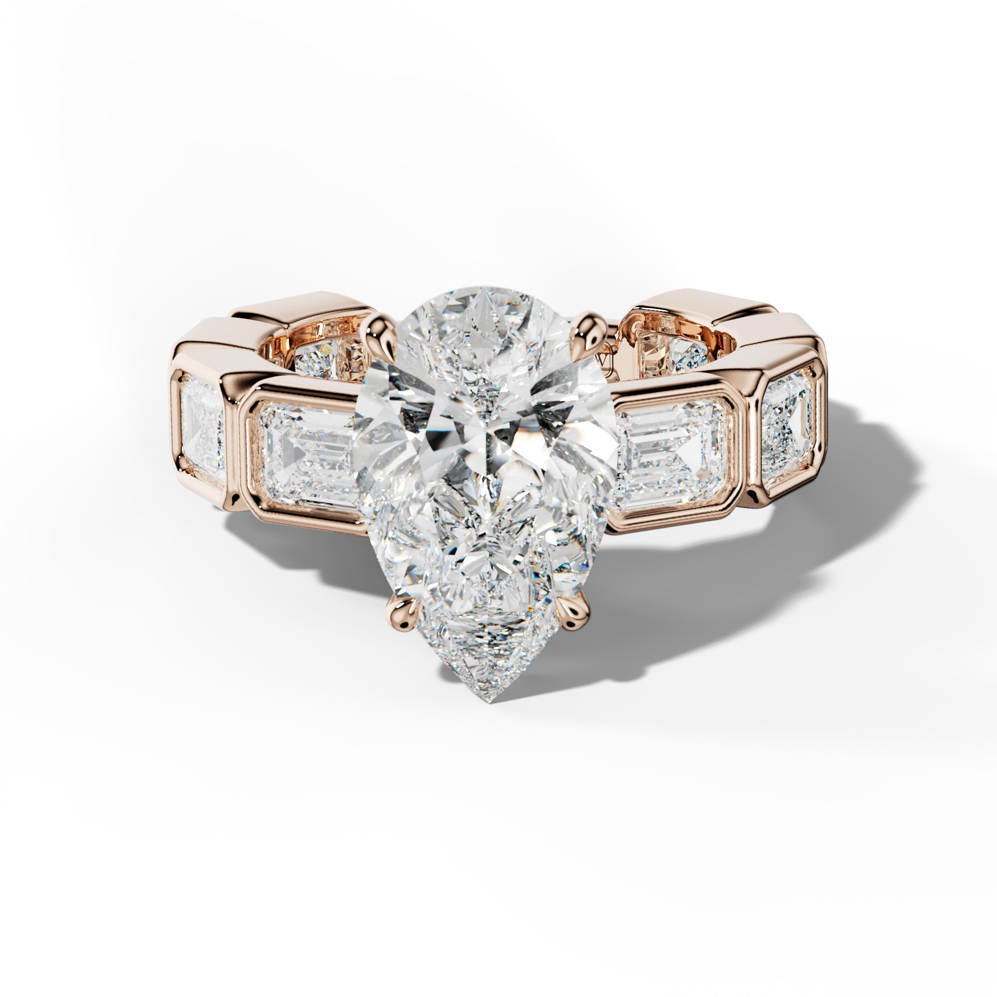 Jessie Pear Shape Engagement Ring With East West Emerald Side Stones