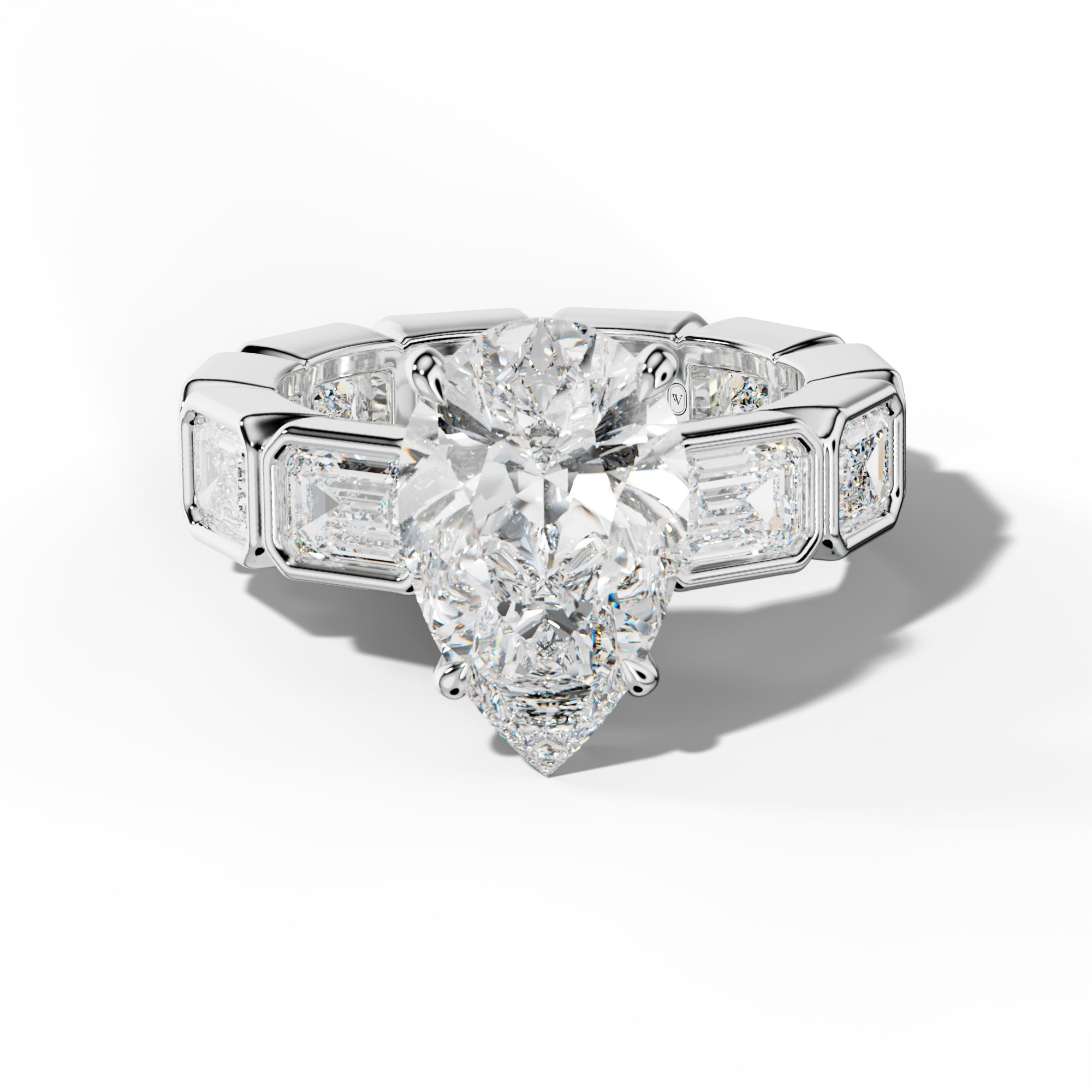 Violeta Pear Shape Engagement Ring With East West Emerald Side Stones