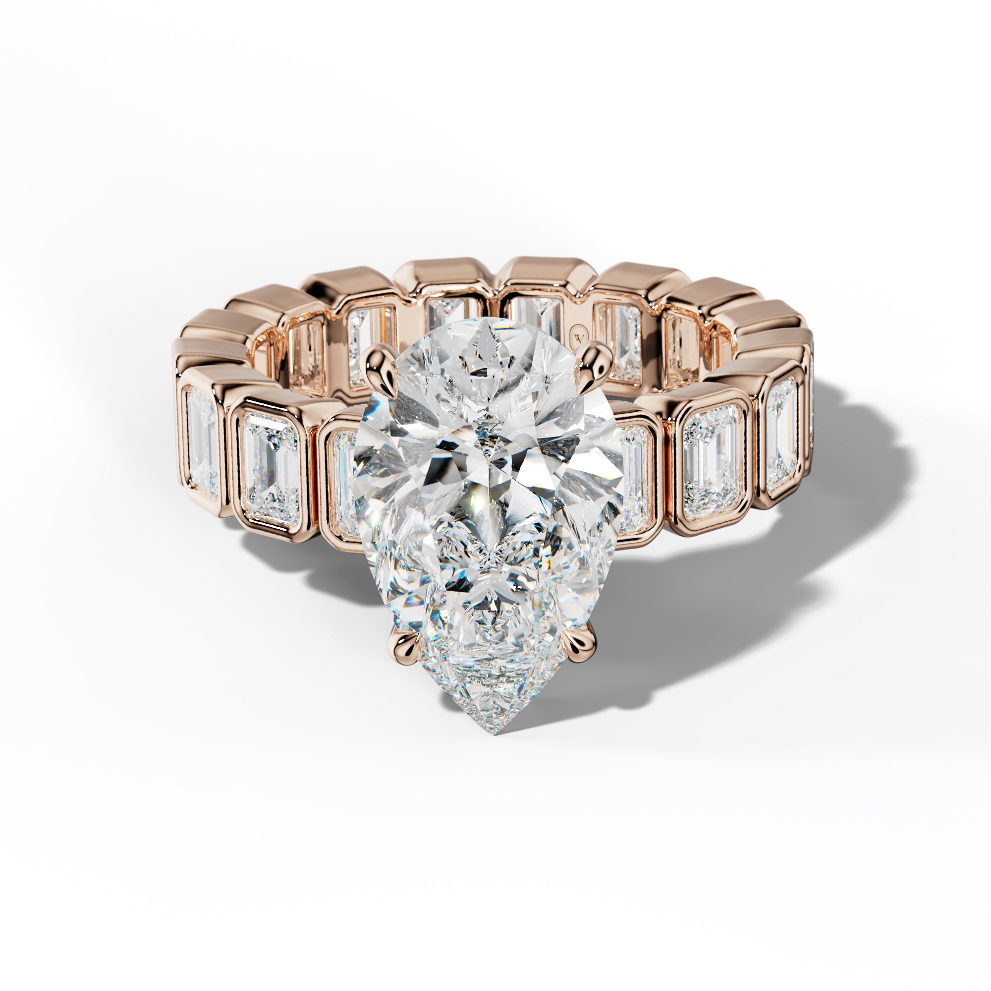 Palmer Pear Shape Engagement Ring With Emerald Side Stones