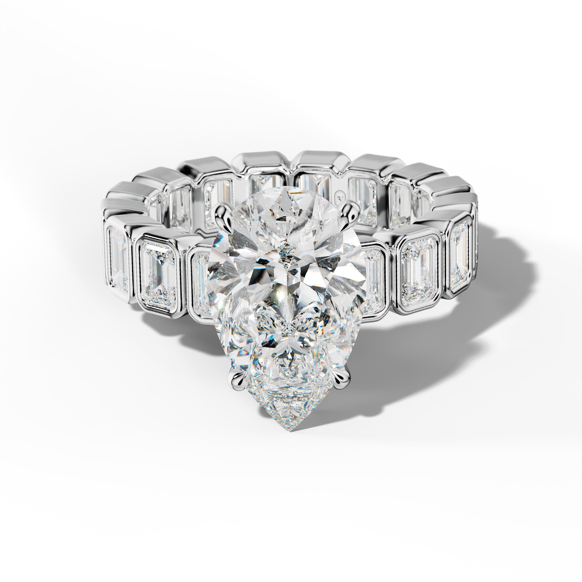 Palmer Pear Shape Engagement Ring With Emerald Side Stones
