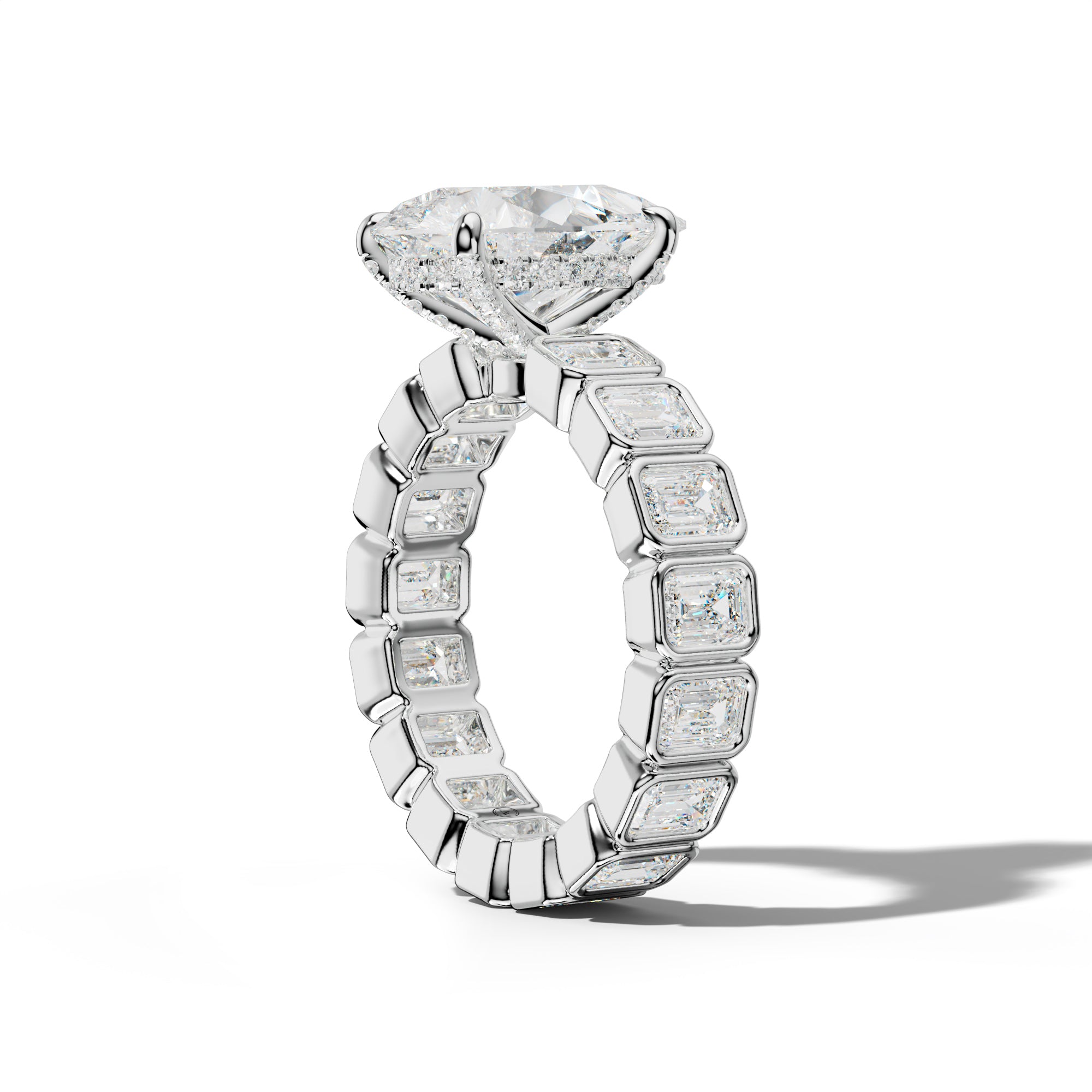 Palmer Pear Shape Engagement Ring With Emerald Side Stones