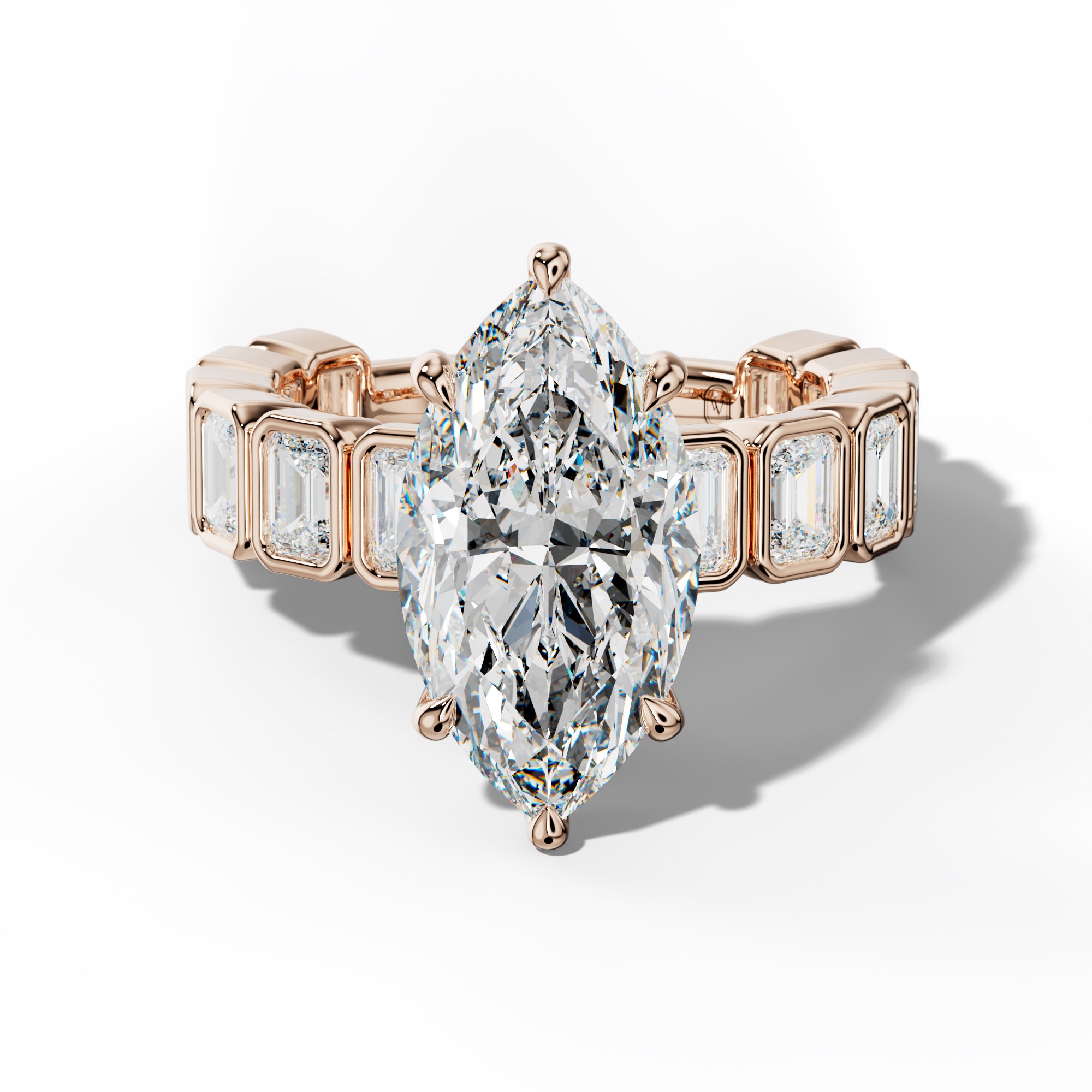 Maizie Marquise Diamond Engagement Ring With Emerald Side Stones