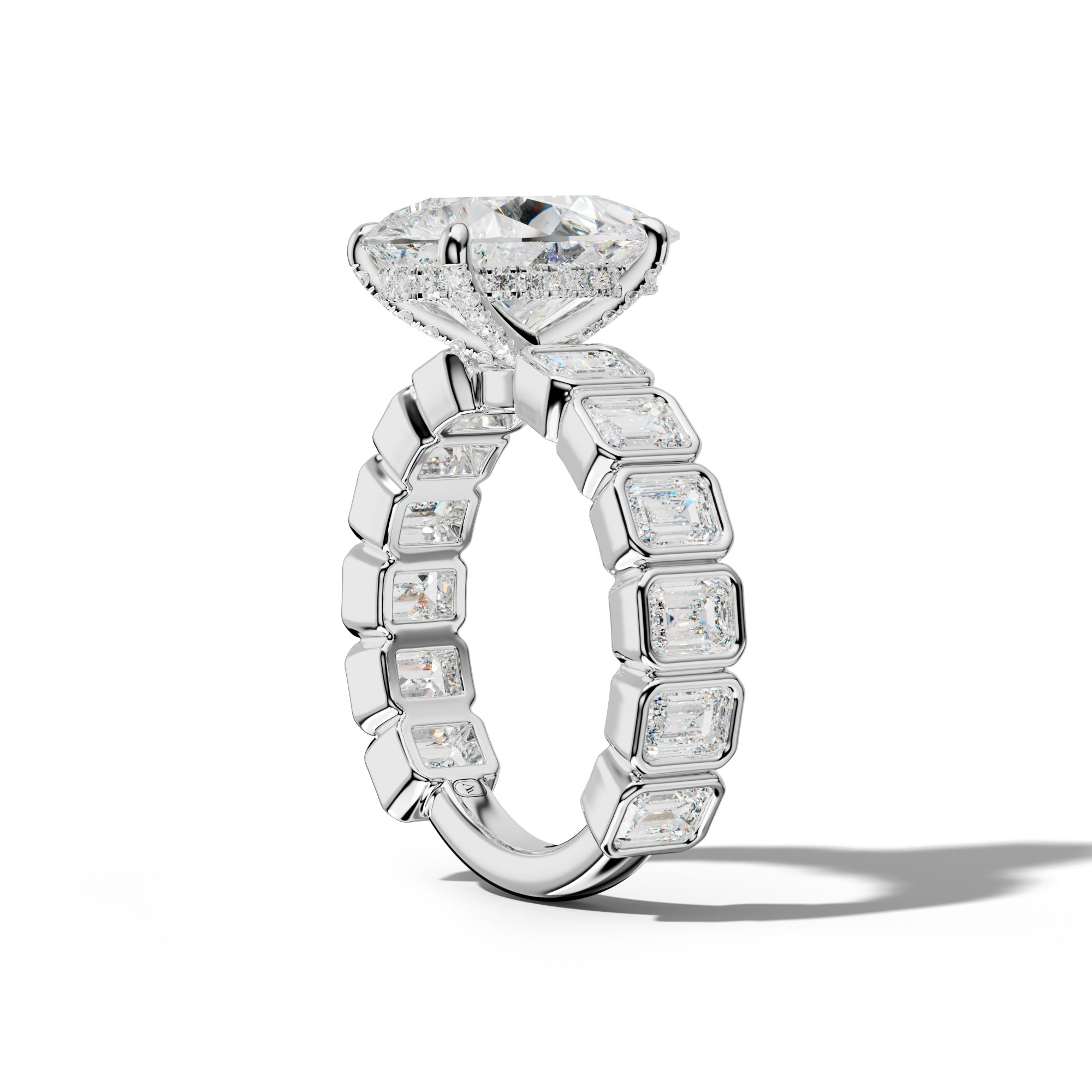 Maizie Pear Shape Engagement Ring With Emerald Side Stones