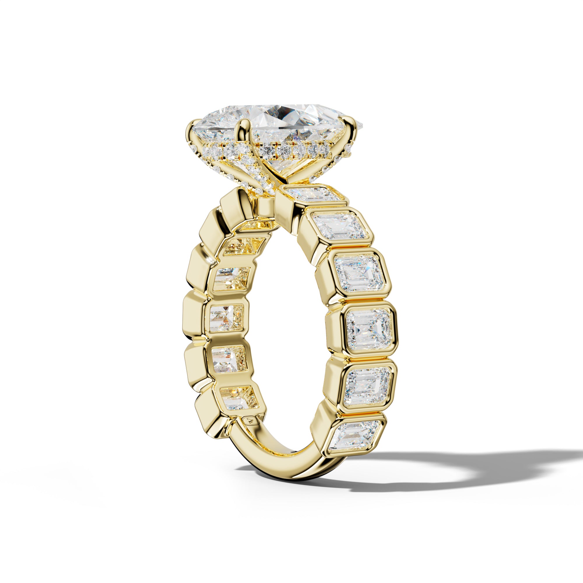 Maizie Pear Shape Engagement Ring With Emerald Side Stones