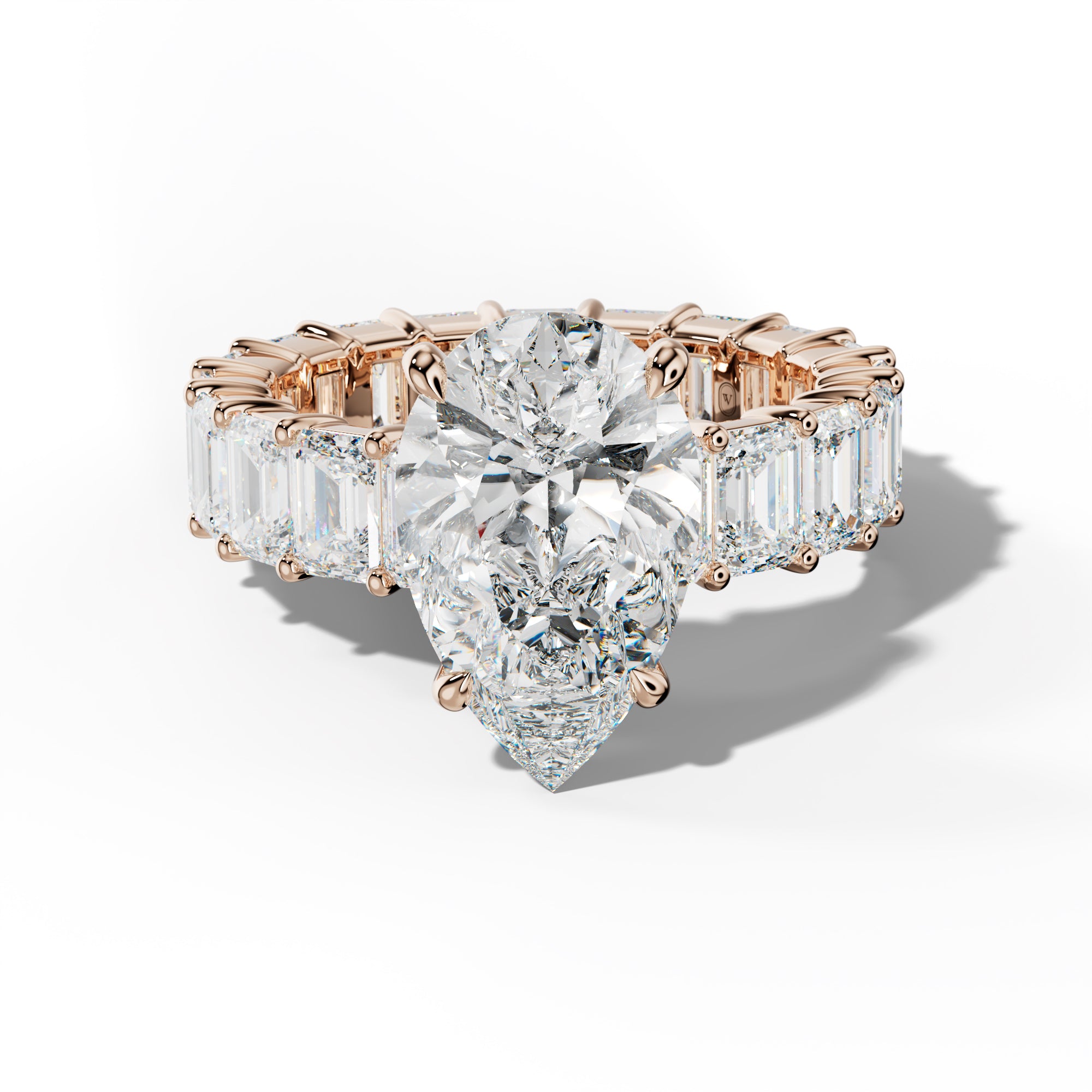 Willow Pear Shape Engagement Ring With Emerald Cut Side Stones