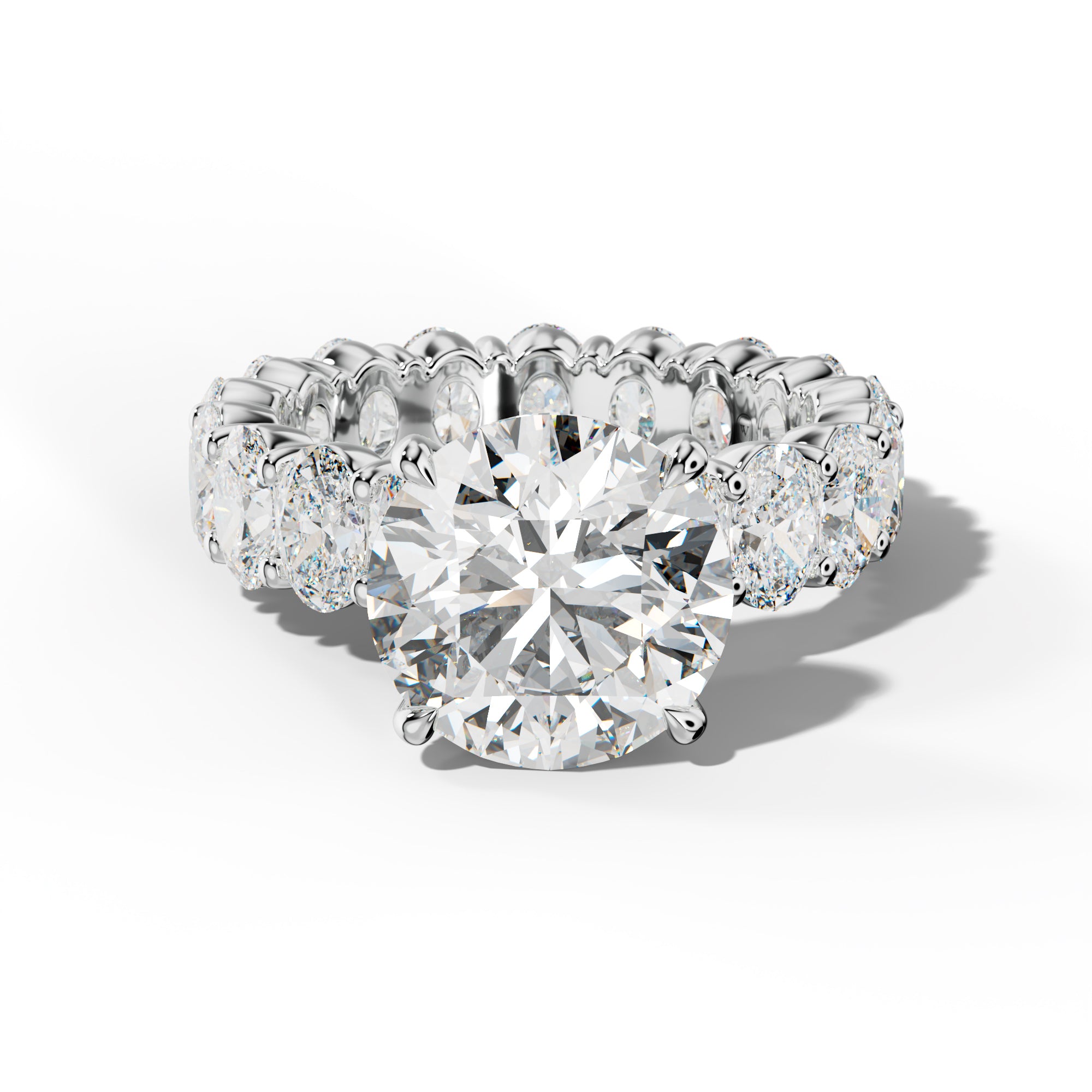 Belen Round Diamond Engagement Ring With Oval Side Stones