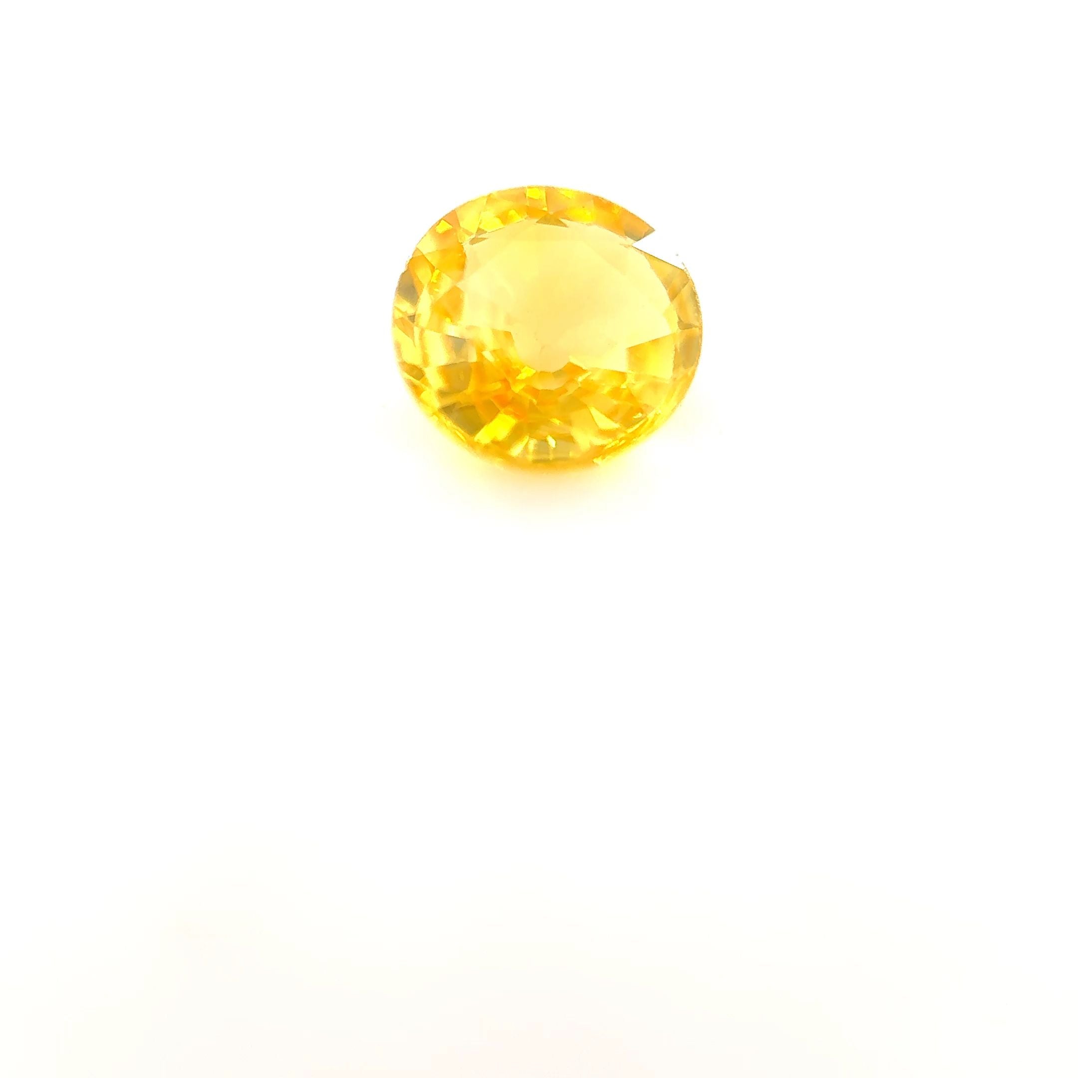 0.69 Carat Round Cut Yellow Sapphire